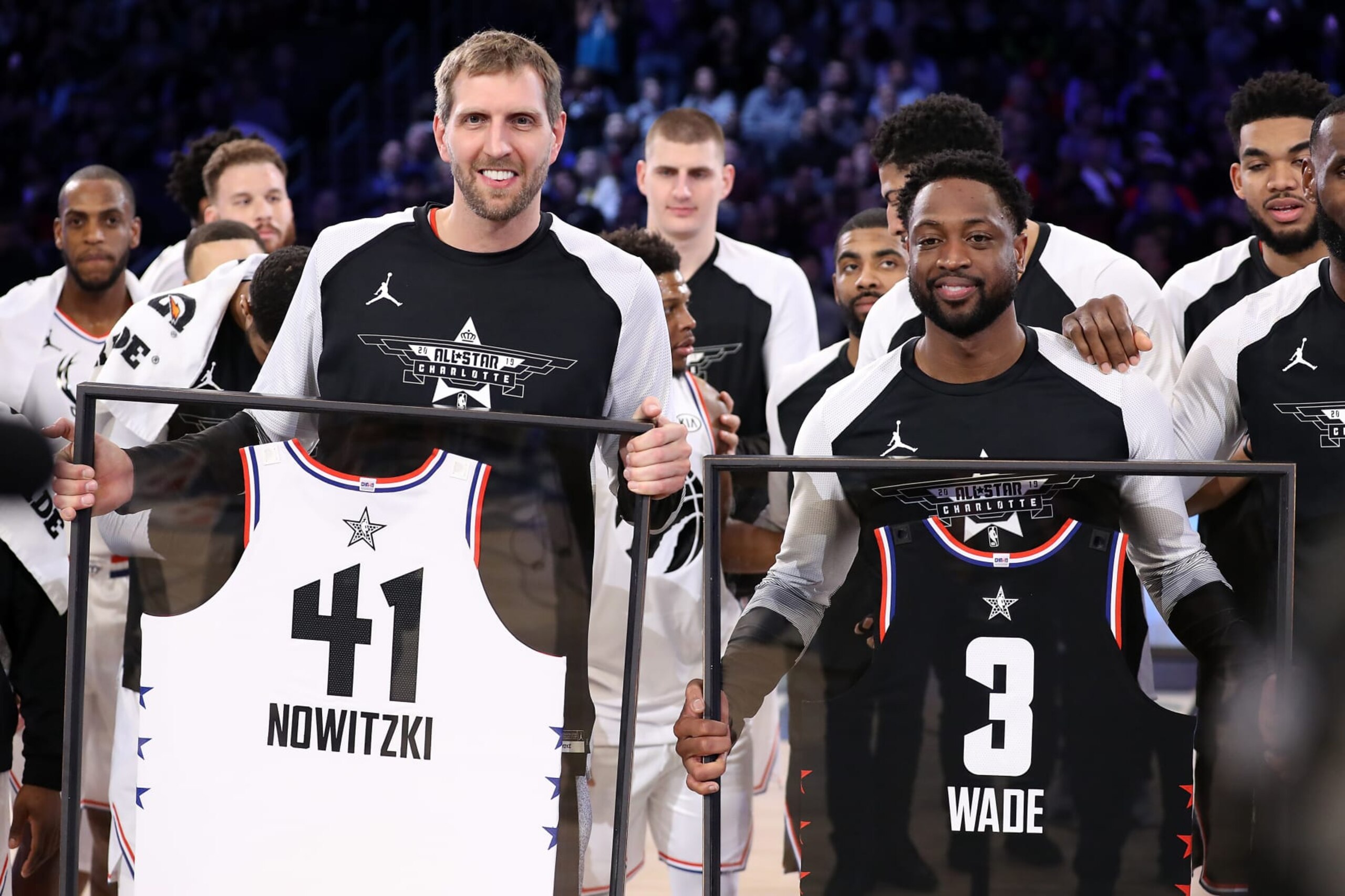 CHARLOTTE, NORTH CAROLINA - FEBRUARY 17:  Dirk Nowitzki #41 of Team Giannis and Dwyane Wade #3 of Team LeBron receive commemorative All-Star jerseys after the NBA All-Star game as part of the 2019 NBA All-Star Weekend at Spectrum Center on February 17, 2019 in Charlotte, North Carolina. Team LeBron won 178-164. NOTE TO USER: User expressly acknowledges and agrees that, by downloading and/or using this photograph, user is consenting to the terms and conditions of the Getty Images License Agreement. (Photo by Streeter Lecka/Getty Images)