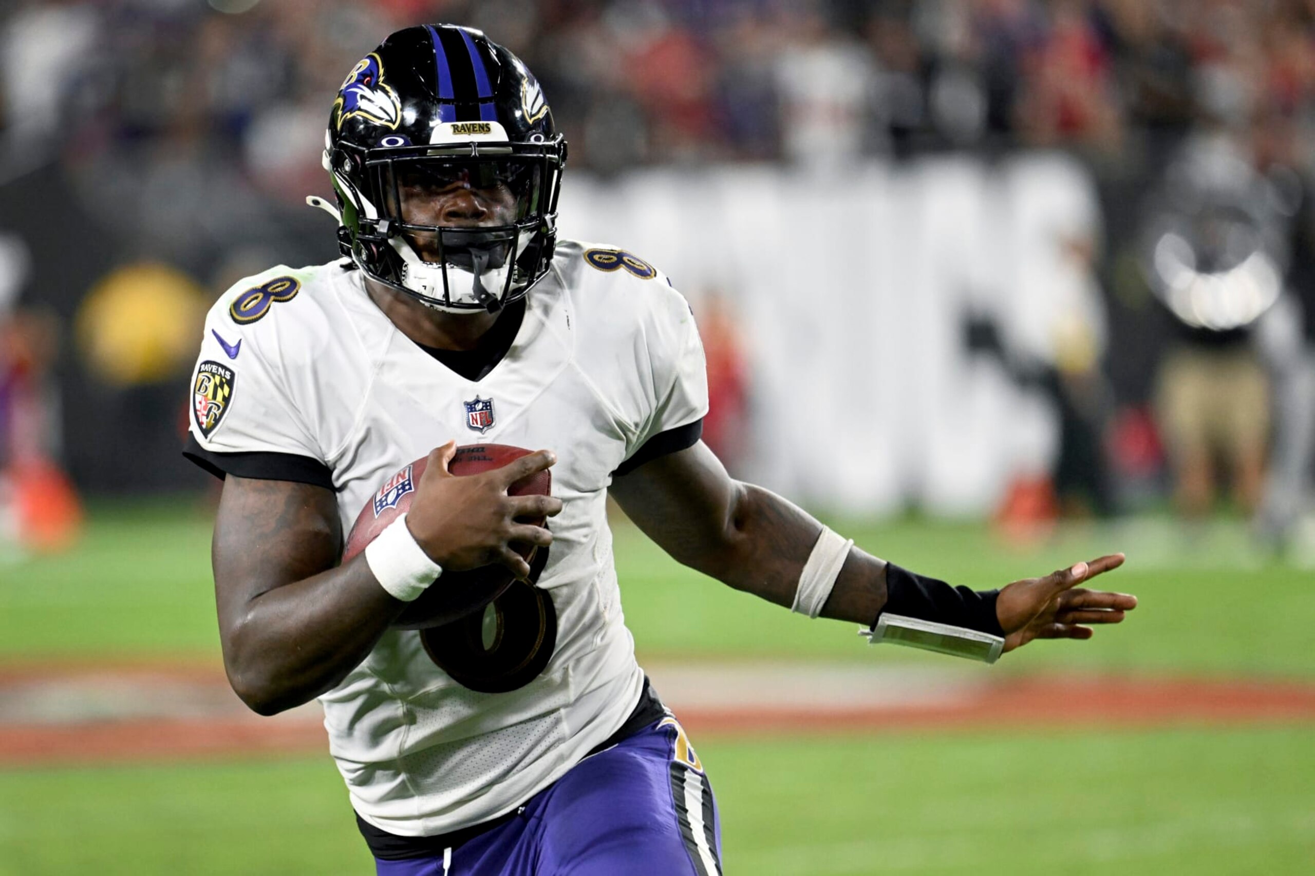 Baltimore Ravens quarterback Lamar Jackson scrambles during the second half of an NFL football game against the Tampa Bay Buccaneers Thursday, Oct. 27, 2022, in Tampa, Fla. (AP Photo/Jason Behnken)