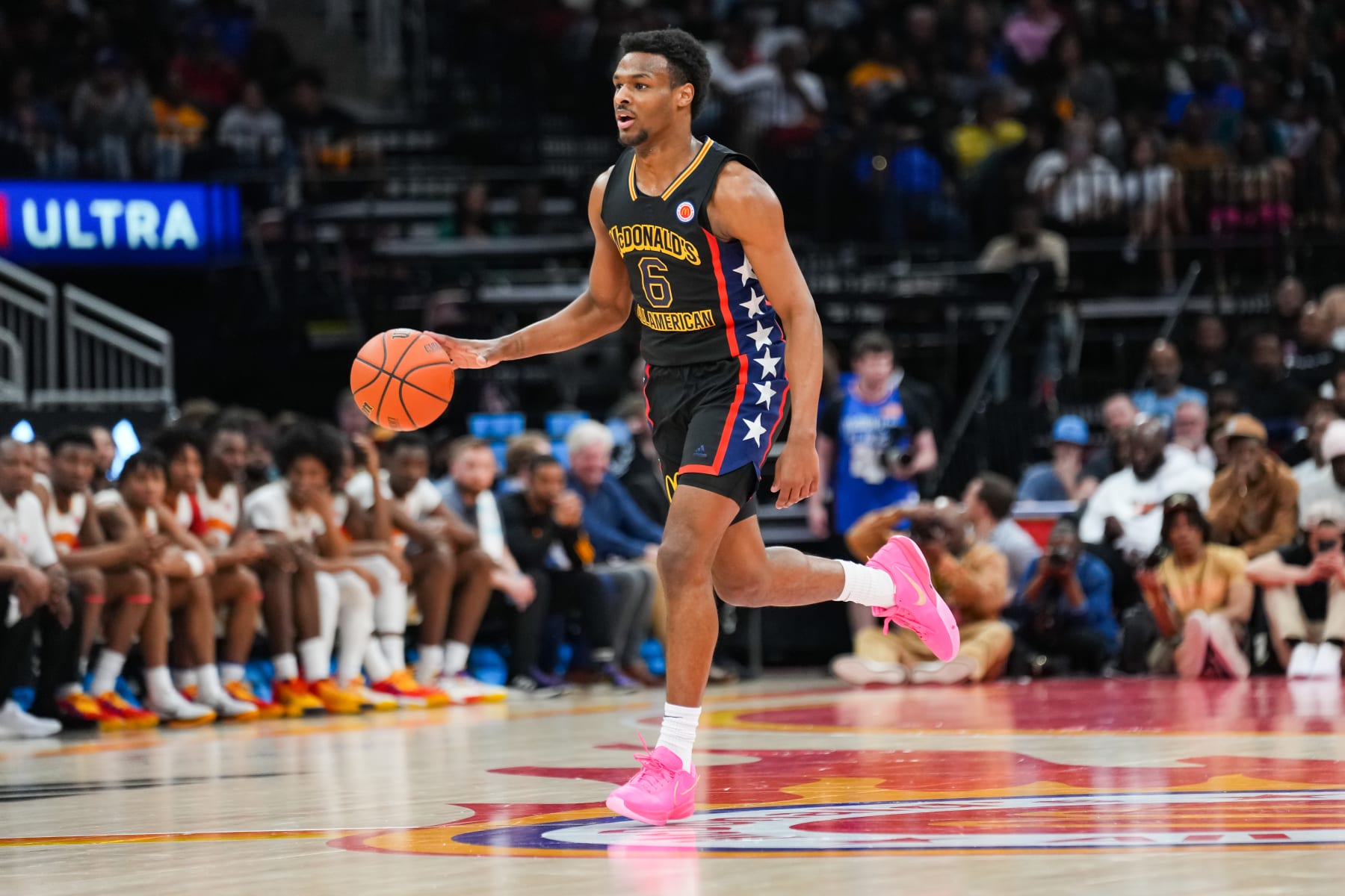 HOUSTON, TEXAS - MARCH 28: Bronny James #6 of the West team dribbles the ball during the 2023 McDonald's High School Boys All-American Game at Toyota Center on March 28, 2023 in Houston, Texas. (Photo by Alex Bierens de Haan/Getty Images)