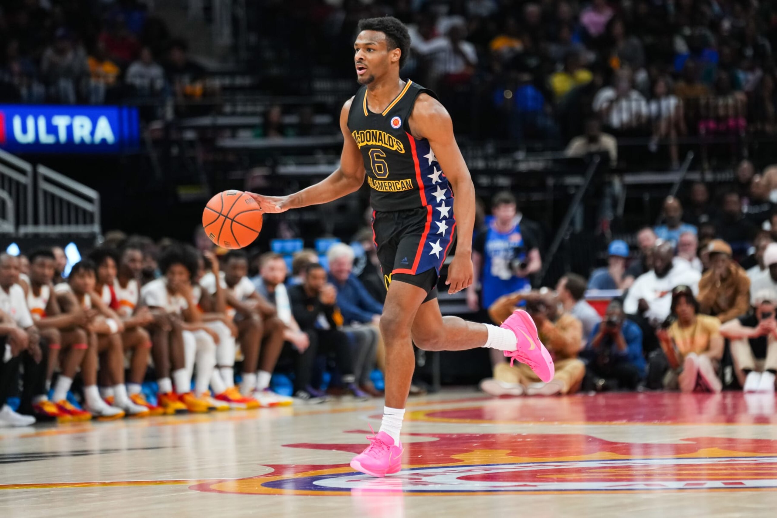 HOUSTON, TEXAS - MARCH 28: Bronny James #6 of the West team dribbles the ball during the 2023 McDonald's High School Boys All-American Game at Toyota Center on March 28, 2023 in Houston, Texas. (Photo by Alex Bierens de Haan/Getty Images)