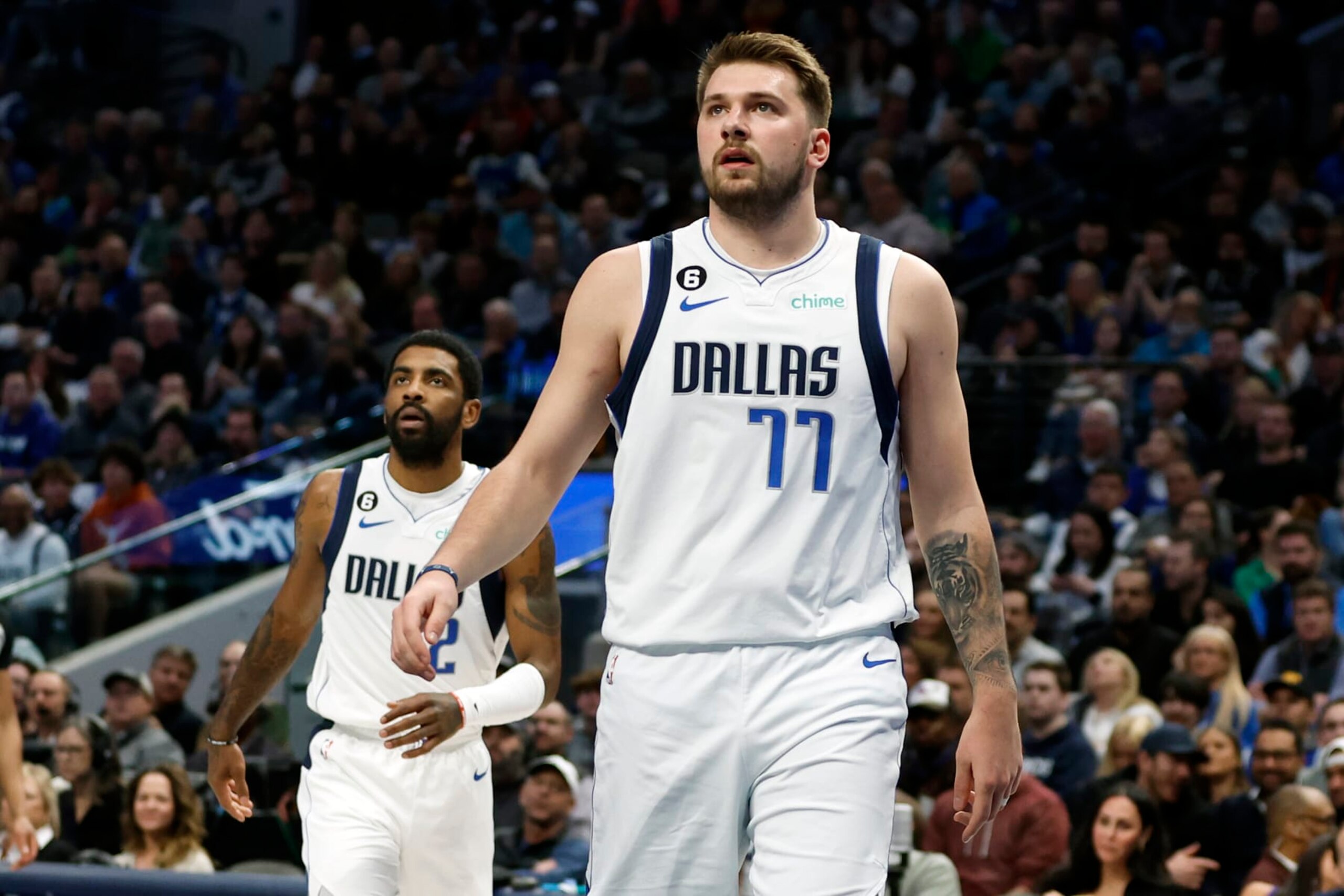 DALLAS, TEXAS - FEBRUARY 23: Luka Doncic #77 and Kyrie Irving #2 of the Dallas Mavericks watch a shot in the first half against the San Antonio Spurs at American Airlines Center on February 23, 2023 in Dallas, Texas. NOTE TO USER: User expressly acknowledges and agrees that, by downloading and or using this photograph, User is consenting to the terms and conditions of the Getty Images License Agreement. (Photo by Tim Heitman/Getty Images) (Photo by Tim Heitman/Getty Images) (Photo by Tim Heitman/Getty Images)