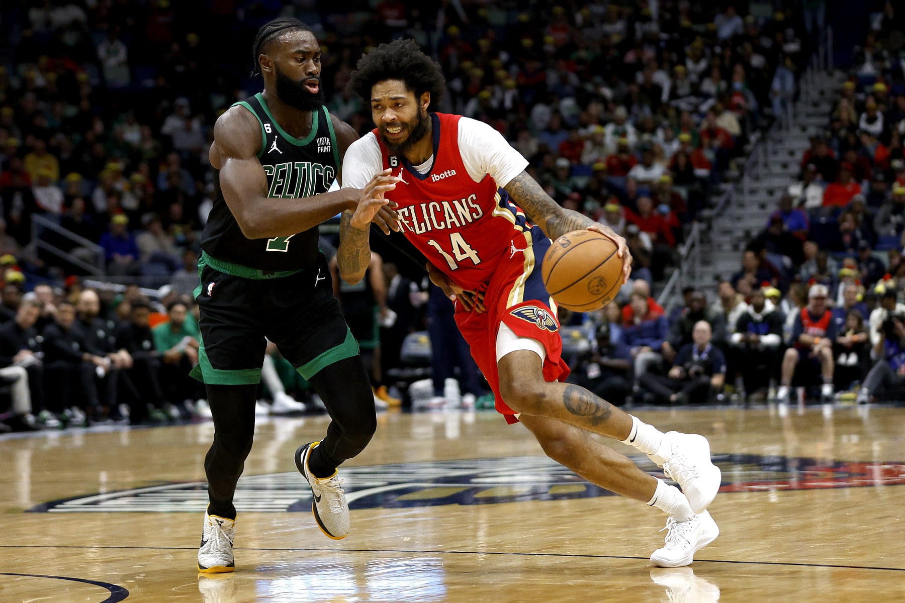 NEW ORLEANS, LOUISIANA - NOVEMBER 18: Brandon Ingram #14 of the New Orleans Pelicans is defended by Jaylen Brown #7 of the Boston Celtics during the first quarter of an NBA game at Smoothie King Center on November 18, 2022 in New Orleans, Louisiana. NOTE TO USER: User expressly acknowledges and agrees that, by downloading and or using this photograph, User is consenting to the terms and conditions of the Getty Images License Agreement. (Photo by Sean Gardner/Getty Images)