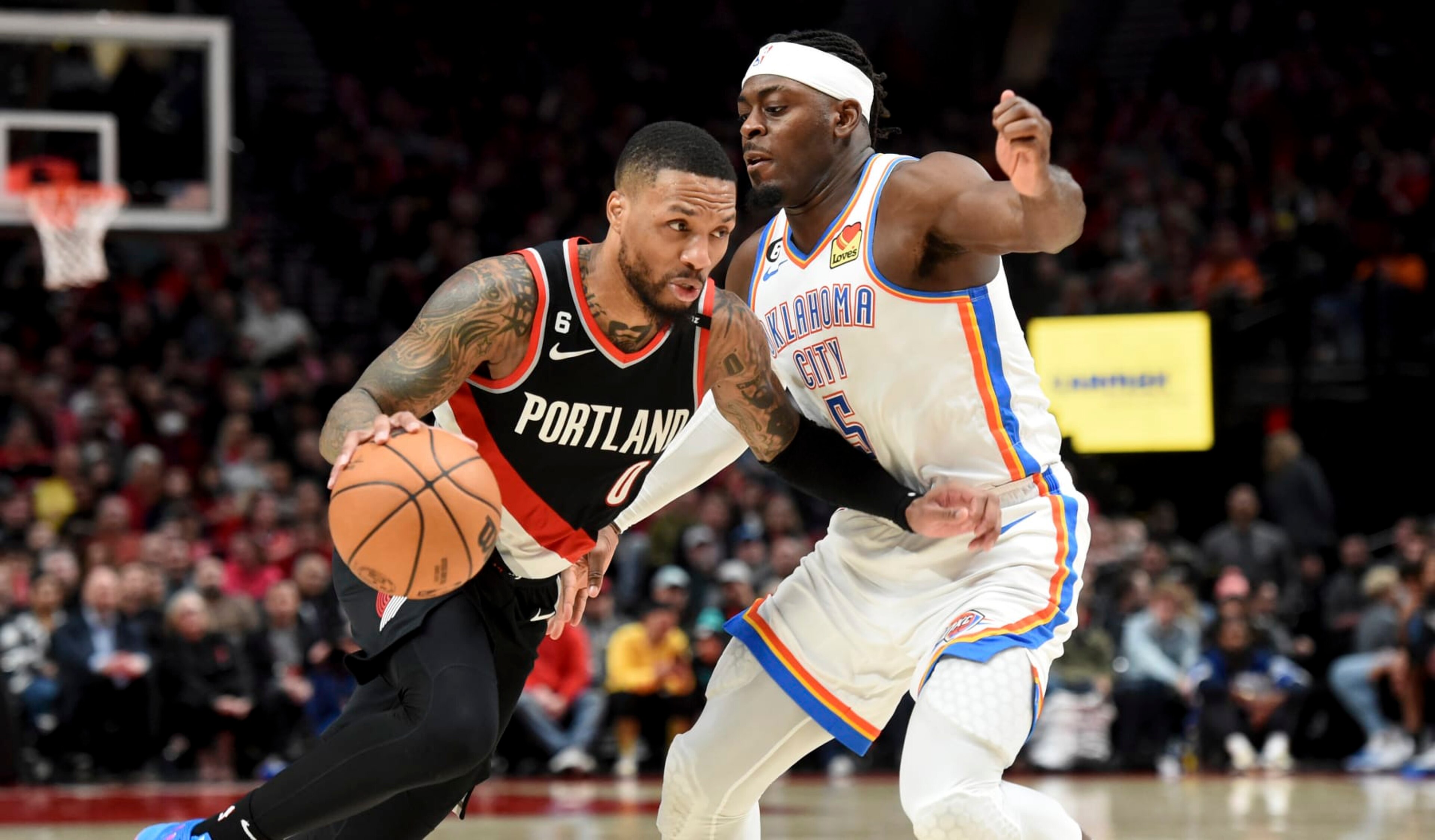 Portland Trail Blazers guard Damian Lillard, left, drives against Oklahoma City Thunder guard Luguentz Dort during the second half of an NBA basketball game in Portland, Ore., Friday, Feb. 10, 2023. The Thunder won 138-129. (AP Photo/Steve Dykes) Portland Trail Blazers guard Damian Lillard, left, drives against Oklahoma City Thunder guard Luguentz Dort during the second half of an NBA basketball game in Portland, Ore., Friday, Feb. 10, 2023. The Thunder won 138-129. (AP Photo/Steve Dykes)