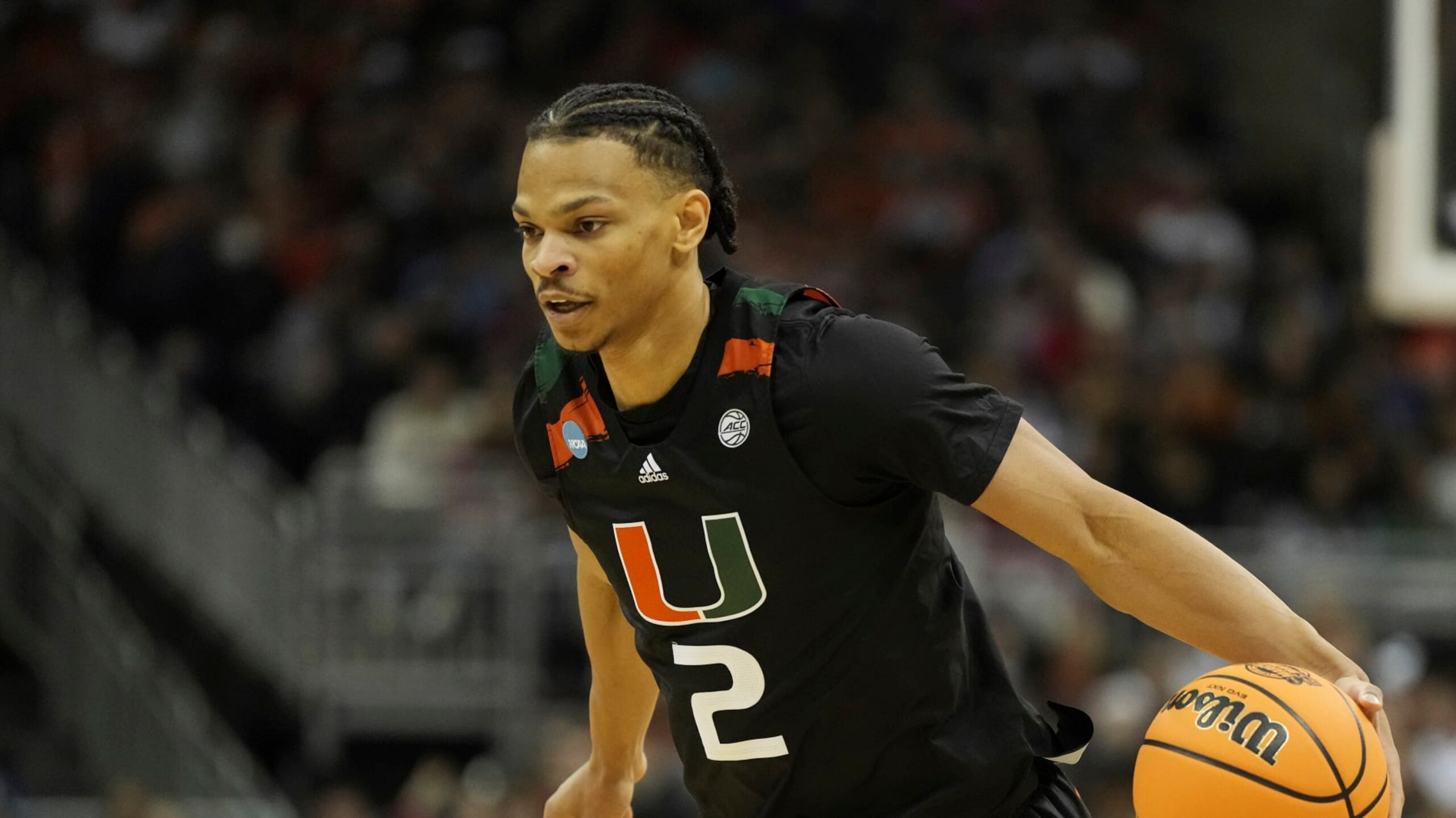 Miami guard Isaiah Wong brings the ball down court against Texas in the first half of an Elite 8 college basketball game in the Midwest Regional of the NCAA Tournament Sunday, March 26, 2023, in Kansas City, Mo. (AP Photo/Jeff Roberson)