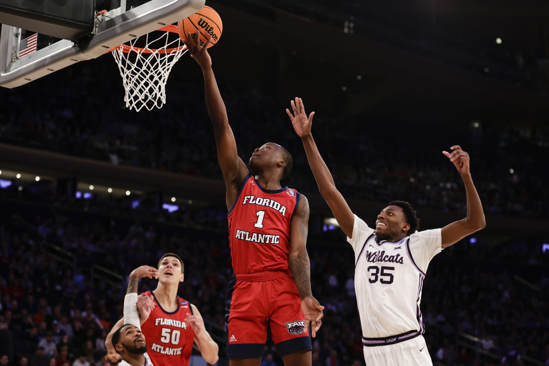 Florida Atlantic's Johnell Davis (1) drives to the basket in the second half of an Elite 8 college basketball game against Kansas State in the NCAA Tournament's East Region final, Saturday, March 25, 2023, in New York. (AP Photo/Adam Hunger)