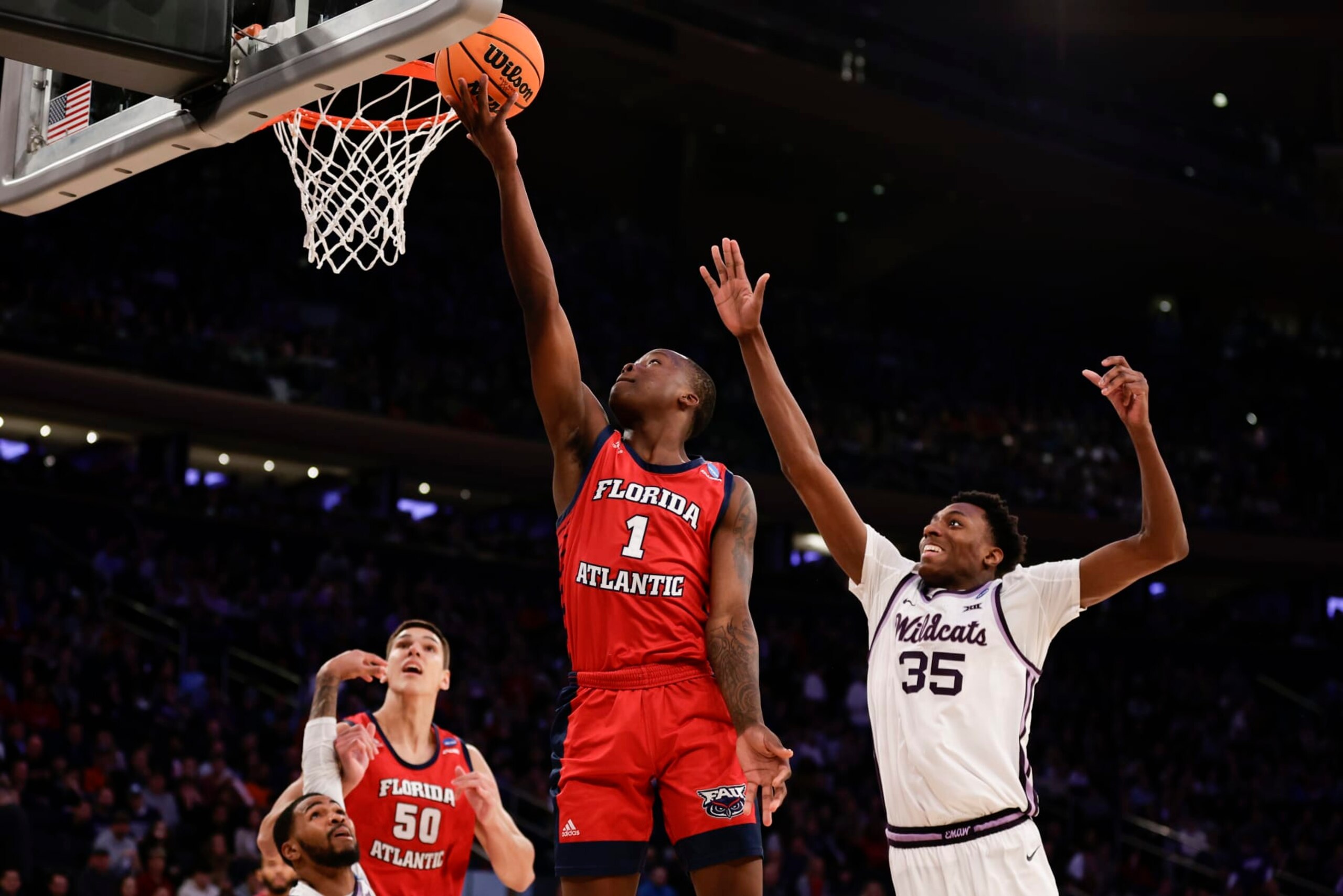Florida Atlantic's Johnell Davis (1) drives to the basket in the second half of an Elite 8 college basketball game against Kansas State in the NCAA Tournament's East Region final, Saturday, March 25, 2023, in New York. (AP Photo/Adam Hunger)