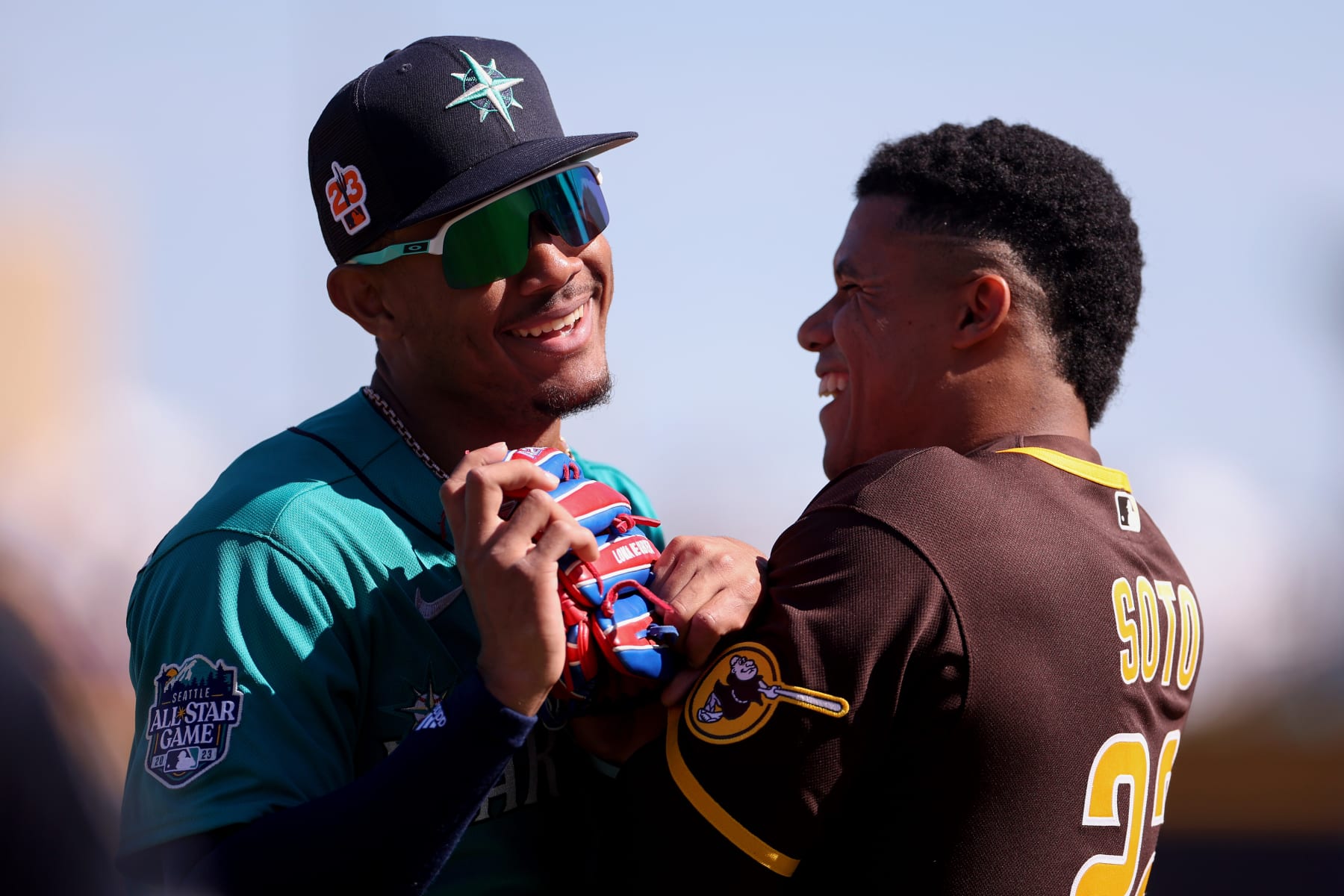 PEORIA, ARIZONA - FEBRUARY 24: Julio Rodriguez #44 of the Seattle Mariners and Juan Soto #22 of the San Diego Padres greet one another during the first inning in a spring training game at Peoria Stadium on February 24, 2023 in Peoria, Arizona. (Photo by Steph Chambers/Getty Images)