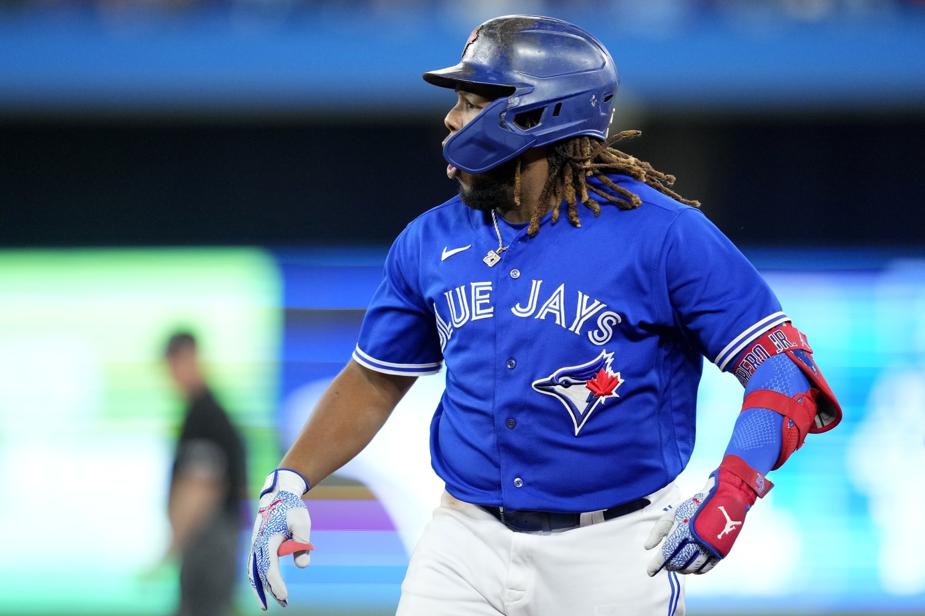 TORONTO, ONTARIO - OCTOBER 08: Vladimir Guerrero Jr. #27 of the Toronto Blue Jays celebrates after hitting a single to center field to score Santiago Espinal #5 against Robbie Ray #38 of the Seattle Mariners during the third inning in game two of the American League Wild Card Series at Rogers Centre on October 08, 2022 in Toronto, Ontario. (Photo by Mark Blinch/Getty Images)
