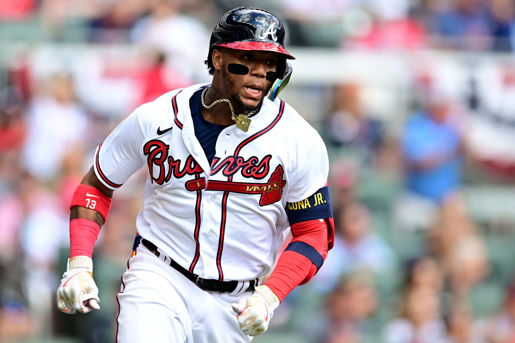 ATLANTA, GEORGIA - OCTOBER 11: Ronald Acuna Jr. #13 of the Atlanta Braves runs the bases after hitting a double against the Philadelphia Phillies during the first inning in game one of the National League Division Series at Truist Park on October 11, 2022 in Atlanta, Georgia. (Photo by Adam Hagy/Getty Images)