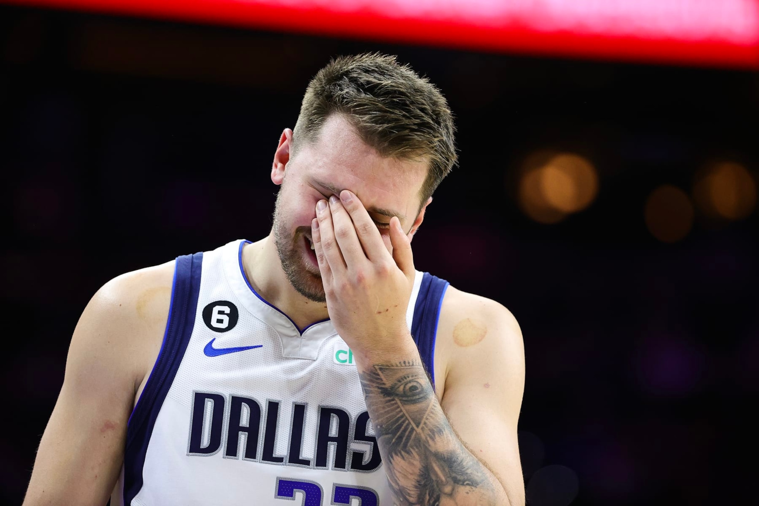 PHILADELPHIA, PENNSYLVANIA - MARCH 29: Luka Doncic #77 of the Dallas Mavericks reacts during the first quarter against the Philadelphia 76ers at Wells Fargo Center on March 29, 2023 in Philadelphia, Pennsylvania. NOTE TO USER: User expressly acknowledges and agrees that, by downloading and or using this photograph, User is consenting to the terms and conditions of the Getty Images License Agreement. (Photo by Tim Nwachukwu/Getty Images)
