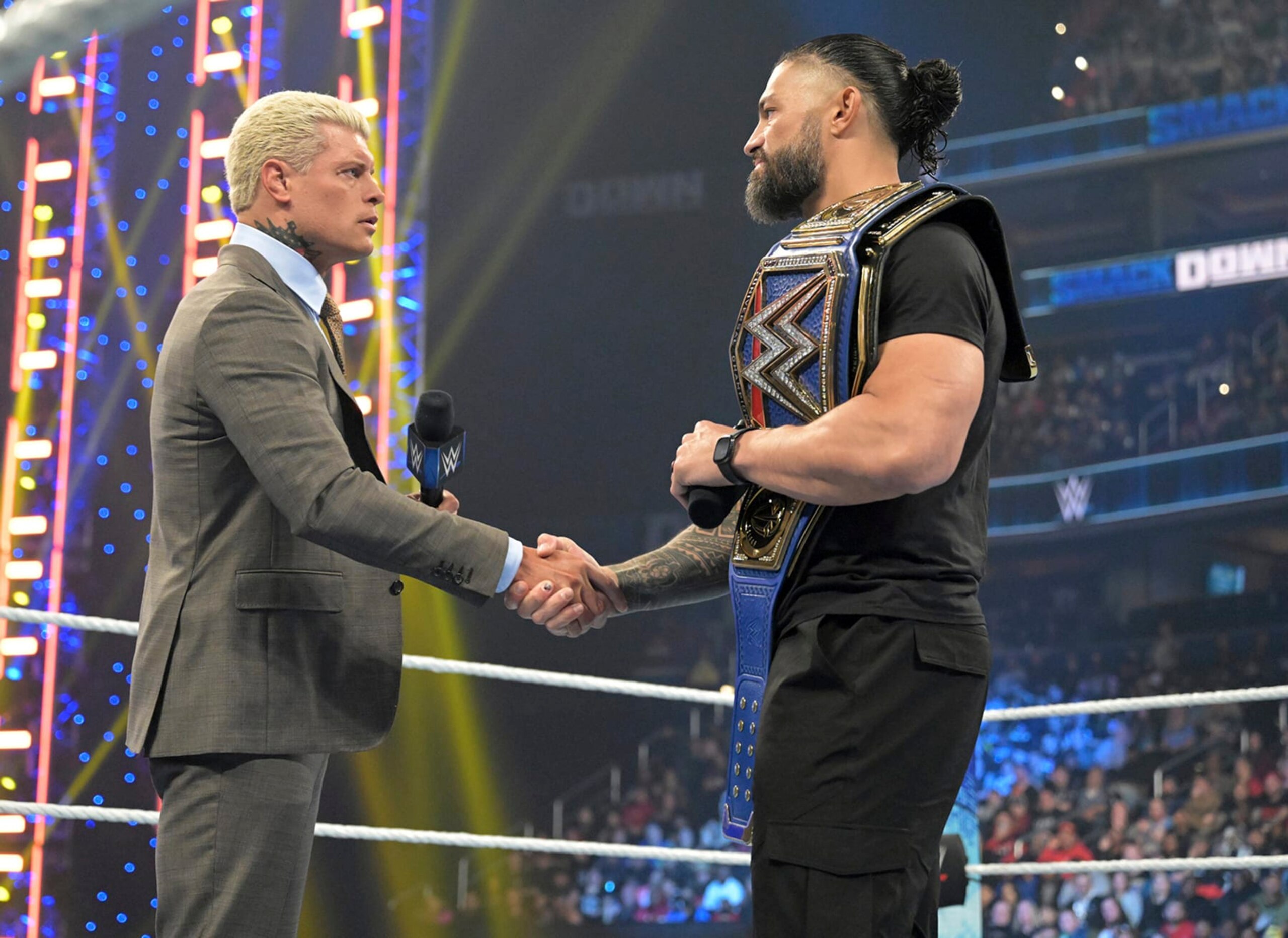 Cody Rhodes, left, and Roman Reigns meet in the center of the ring during an episode of WWE Smackdown on March 3, 2023, in Washington. Rhodes and Reigns will be in the main event of WrestleMania 39 on Sunday, April 2, 2023, in Los Angeles. (WWE via AP)