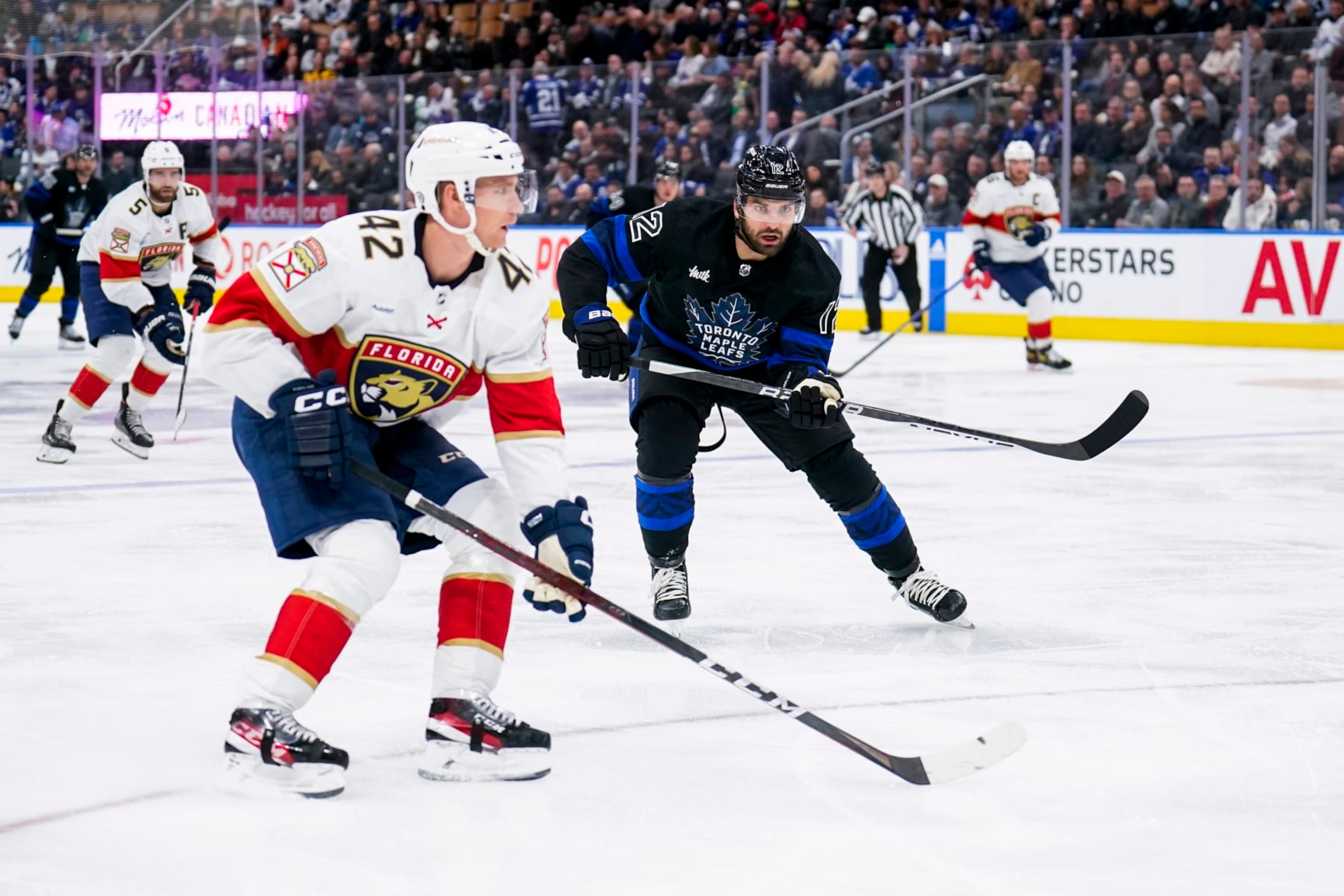 TORONTO, ON - MARCH 29: Zach Aston-Reese #12 of the Toronto Maple Leafs skates against Gustav Forsling #42 of the Florida Panthers during the third period at the Scotiabank Arena on March 29, 2023 in Toronto, Ontario, Canada. (Photo by Andrew Lahodynskyj/NHLI via Getty Images)