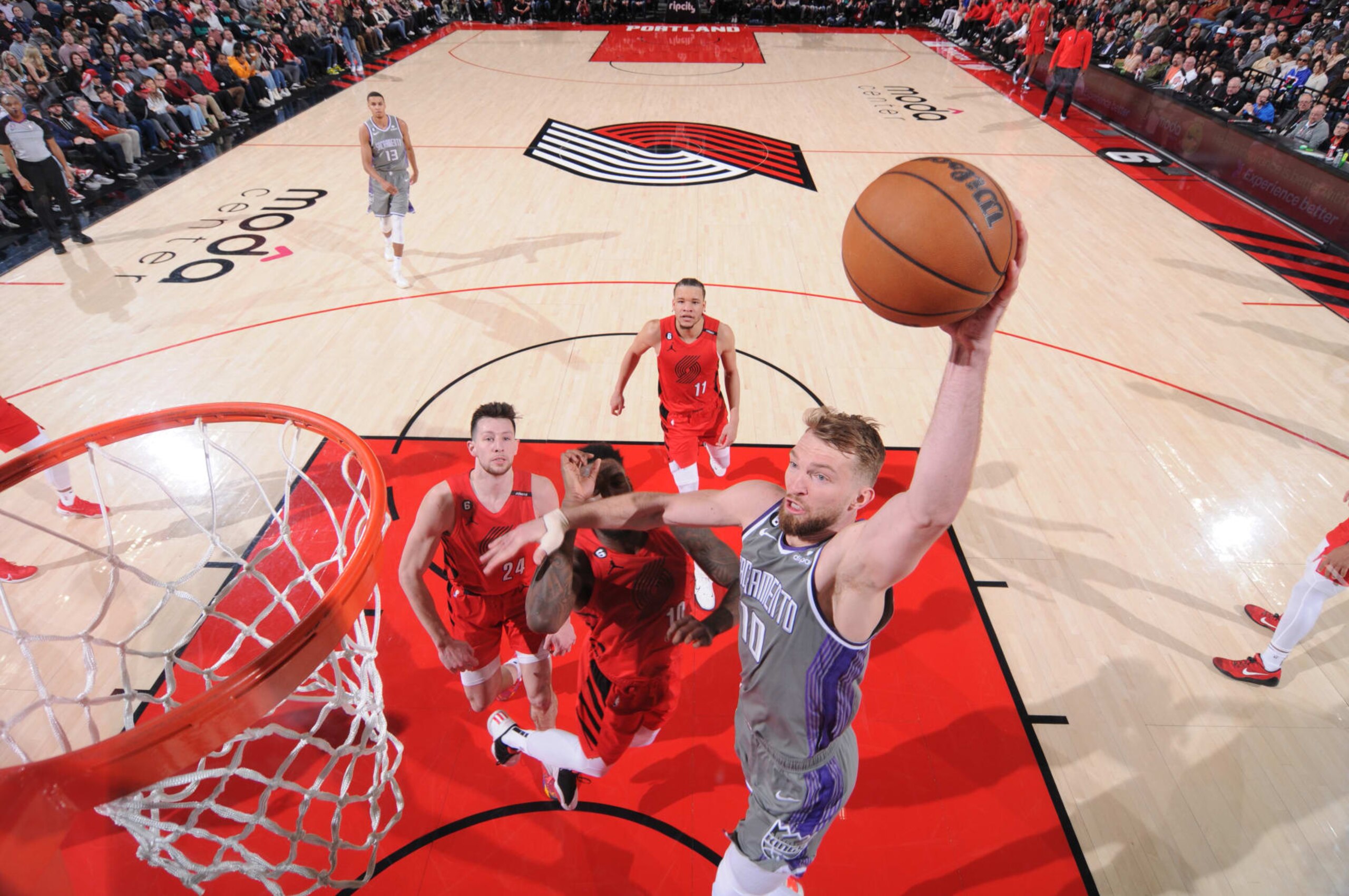 PORTLAND, OR - MARCH 29:  Domantas Sabonis #10 of the Sacramento Kings goes to the basket during the game on March 29, 2023 at the Moda Center Arena in Portland, Oregon. NOTE TO USER: User expressly acknowledges and agrees that, by downloading and or using this photograph, user is consenting to the terms and conditions of the Getty Images License Agreement. Mandatory Copyright Notice: Copyright 2023 NBAE (Photo by Sam Forencich/NBAE via Getty Images)