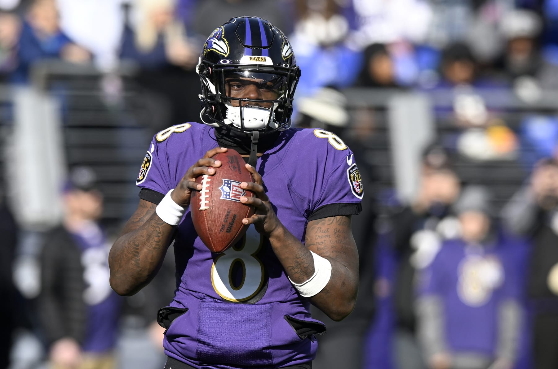 BALTIMORE, MARYLAND - DECEMBER 04: Lamar Jackson #8 of the Baltimore Ravens warms up before the game against the Denver Broncos at M&T Bank Stadium on December 04, 2022 in Baltimore, Maryland. (Photo by G Fiume/Getty Images)