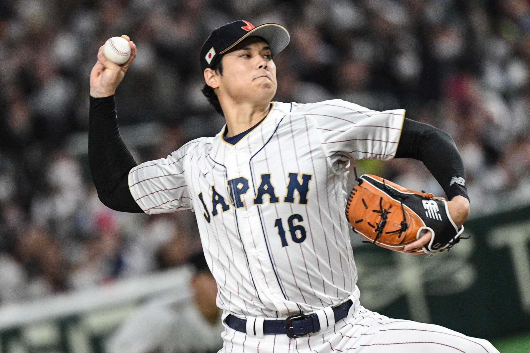 Japan's Shohei Ohtani pitches in the first inning during the World Baseball Classic (WBC) quarter-final game between Japan and Italy at the Tokyo Dome in Tokyo on March 16, 2023. (Photo by Richard A. Brooks / AFP) (Photo by RICHARD A. BROOKS/AFP via Getty Images)