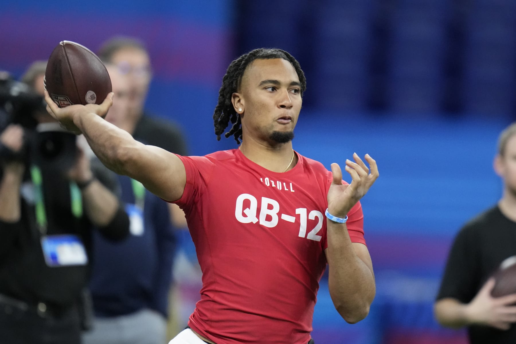 Ohio State quarterback CJ Stroud runs a drill at the NFL football scouting combine in Indianapolis, Saturday, March 4, 2023. (AP Photo/Michael Conroy)