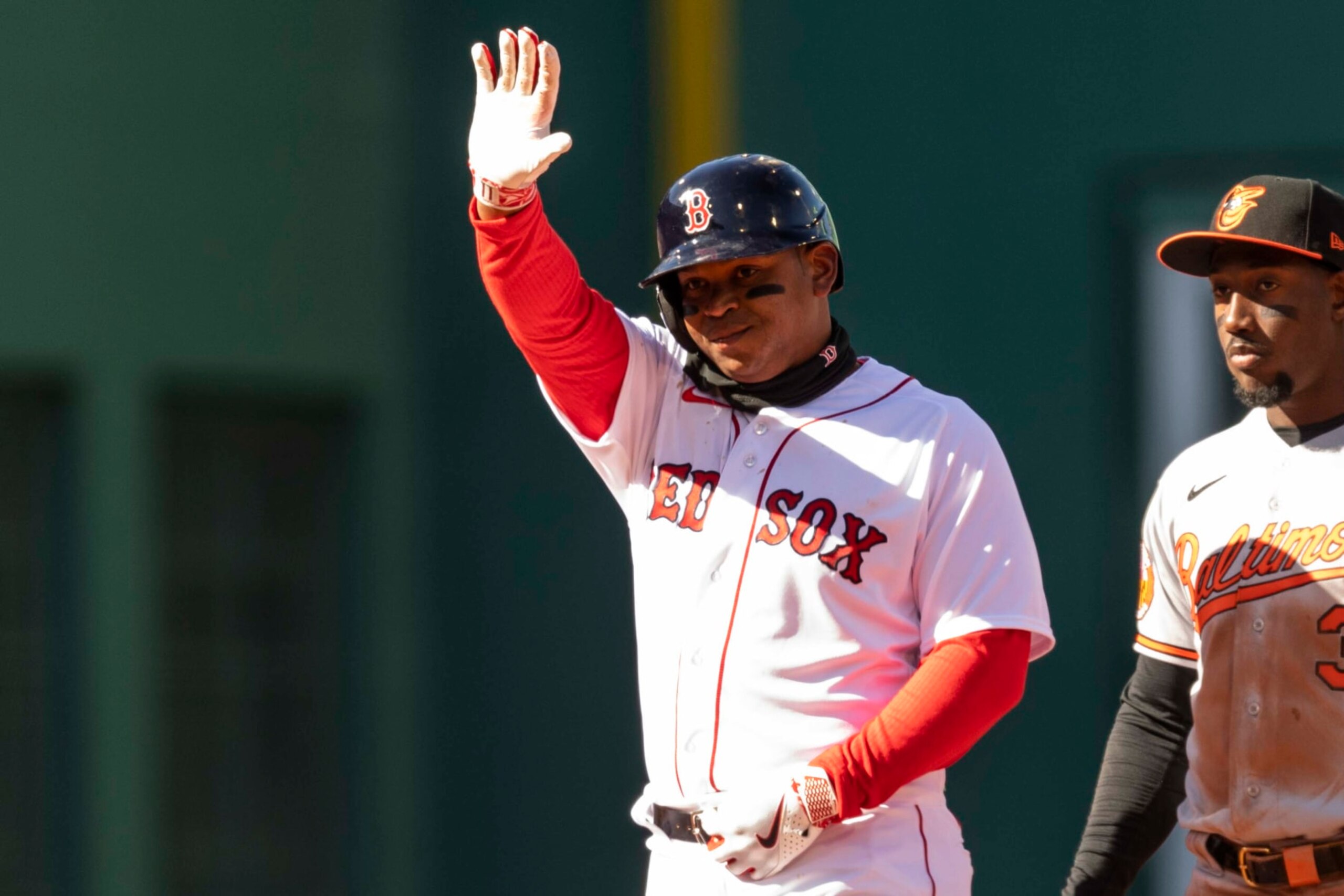 BOSTON, MA - MARCH 30: Rafael Devers #11 of the Boston Red Sox reacts after hitting a double during the fourth inning of the 2023 Opening Day Game game against the Baltimore Orioles on March 30, 2023 at Fenway Park in Boston, Massachusetts. (Photo by Billie Weiss/Boston Red Sox/Getty Images)