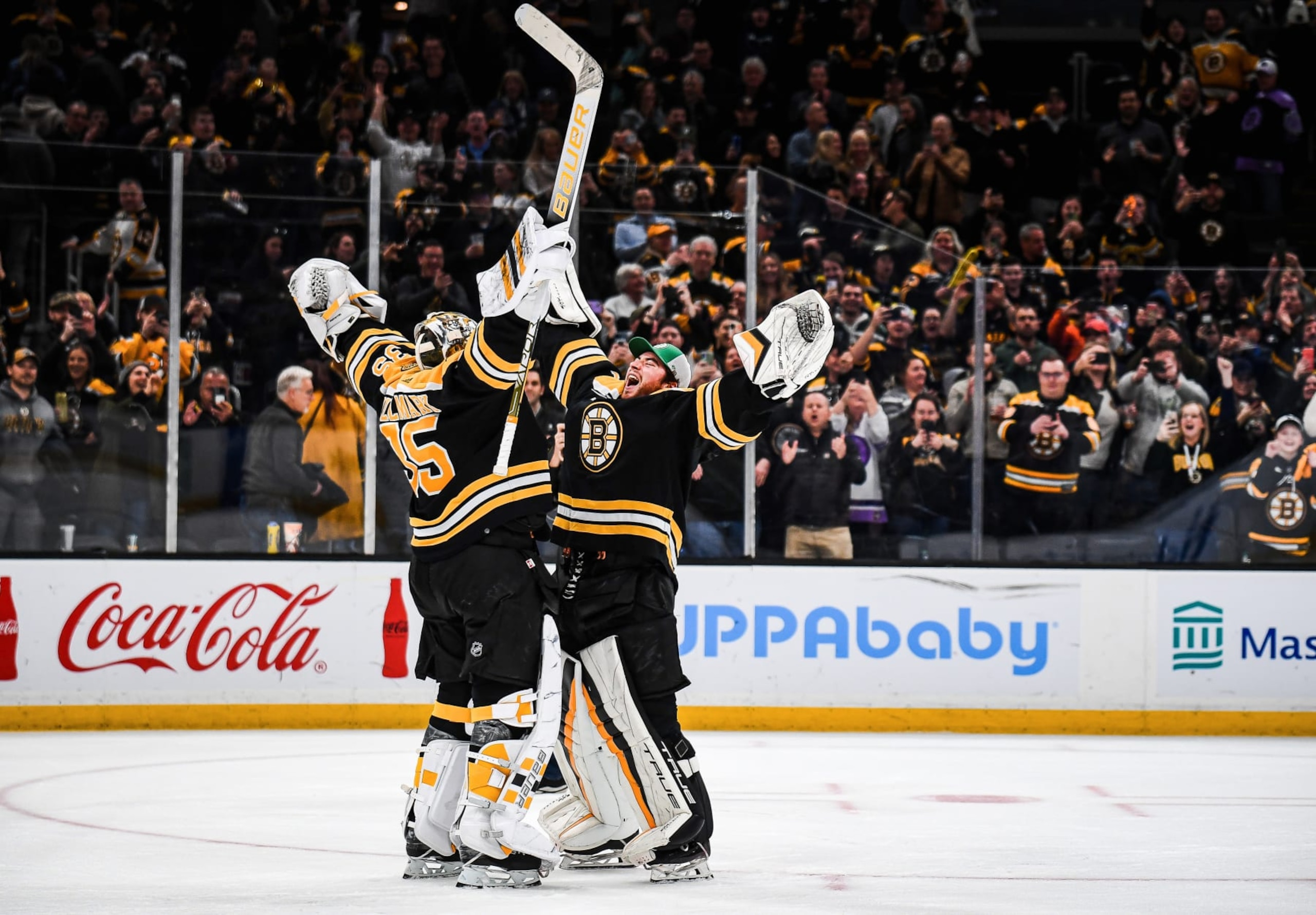 BOSTON, MASSACHUSETTS - MARCH 21: Linus Ullmark #35 and Jeremy Swayman #1 of the Boston Bruins celebrate after a win against the Ottawa Senators at TD Garden on March 21, 2023 in Boston, Massachusetts. (Photo by China Wong/NHLI via Getty Images)