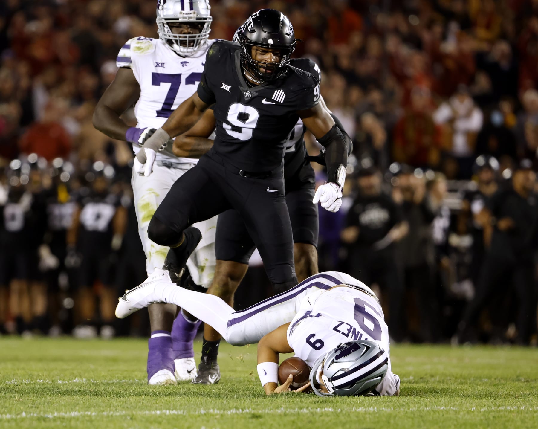 AMES, IA - OCTOBER 8:  Defensive end Will McDonald IV #9 of the Iowa State Cyclones celebrates after sacking quarterback Adrian Martinez #9 of the Kansas State Wildcats as offensive lineman Christian Duffie #73 of the Kansas State Wildcats watches on in the first half of play at Jack Trice Stadium on October 8, 2022 in Ames, Iowa. (Photo by David Purdy/Getty Images)