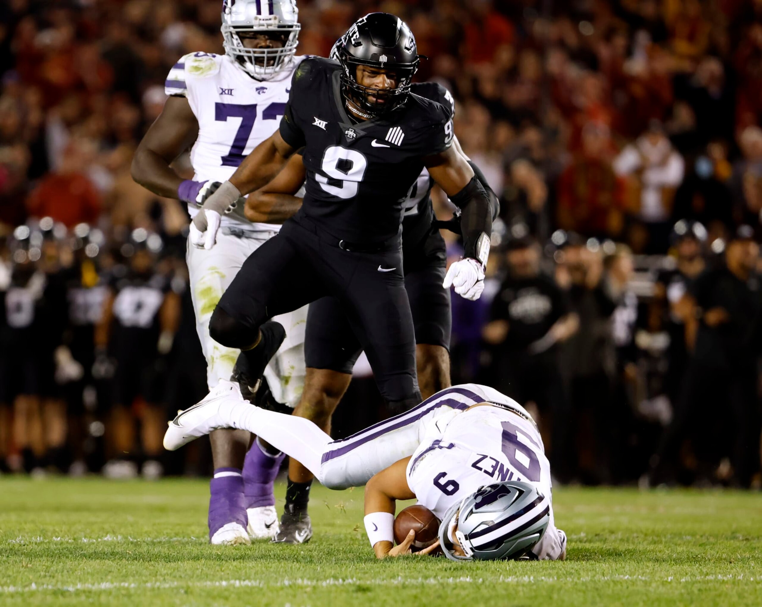 AMES, IA - OCTOBER 8:  Defensive end Will McDonald IV #9 of the Iowa State Cyclones celebrates after sacking quarterback Adrian Martinez #9 of the Kansas State Wildcats as offensive lineman Christian Duffie #73 of the Kansas State Wildcats watches on in the first half of play at Jack Trice Stadium on October 8, 2022 in Ames, Iowa. (Photo by David Purdy/Getty Images)