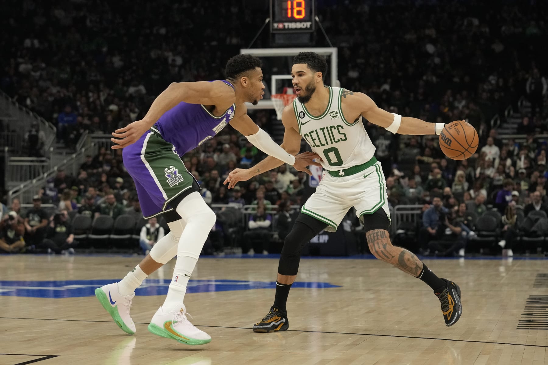 MILWAUKEE, WISCONSIN - MARCH 30: Jayson Tatum #0 of the Boston Celtics dribbles the ball against Giannis Antetokounmpo #34 of the Milwaukee Bucks in the second half at Fiserv Forum on March 30, 2023 in Milwaukee, Wisconsin. NOTE TO USER: User expressly acknowledges and agrees that, by downloading and or using this photograph, user is consenting to the terms and conditions of the Getty Images License Agreement. (Photo by Patrick McDermott/Getty Images)