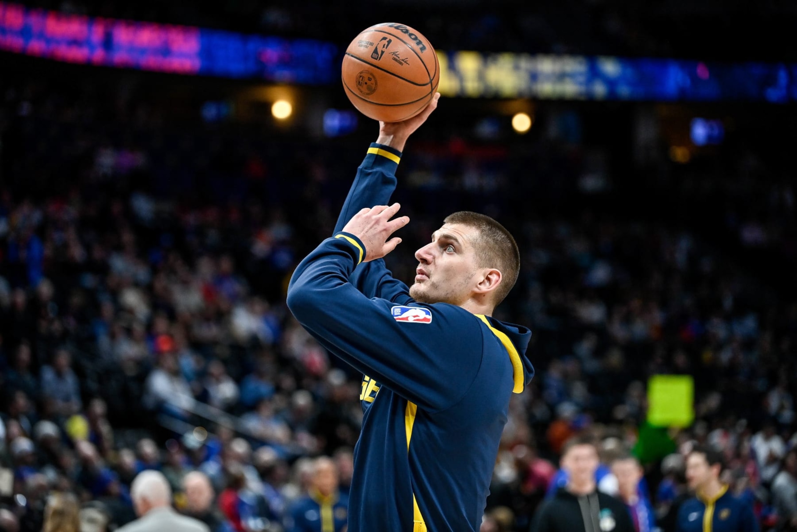 DENVER, CO - MARCH 27: Nikola Jokic #15 of the Denver Nuggets warms up before a game against the Philadelphia 76ers at Ball Arena on March 27, 2023 in Denver, Colorado. NOTE TO USER: User expressly acknowledges and agrees that, by downloading and or using this photograph, User is consenting to the terms and conditions of the Getty Images License Agreement. (Photo by Dustin Bradford/Getty Images) DENVER, CO - MARCH 27: Nikola Jokic #15 of the Denver Nuggets warms up before a game against the Philadelphia 76ers at Ball Arena on March 27, 2023 in Denver, Colorado. NOTE TO USER: User expressly acknowledges and agrees that, by downloading and or using this photograph, User is consenting to the terms and conditions of the Getty Images License Agreement. (Photo by Dustin Bradford/Getty Images)
