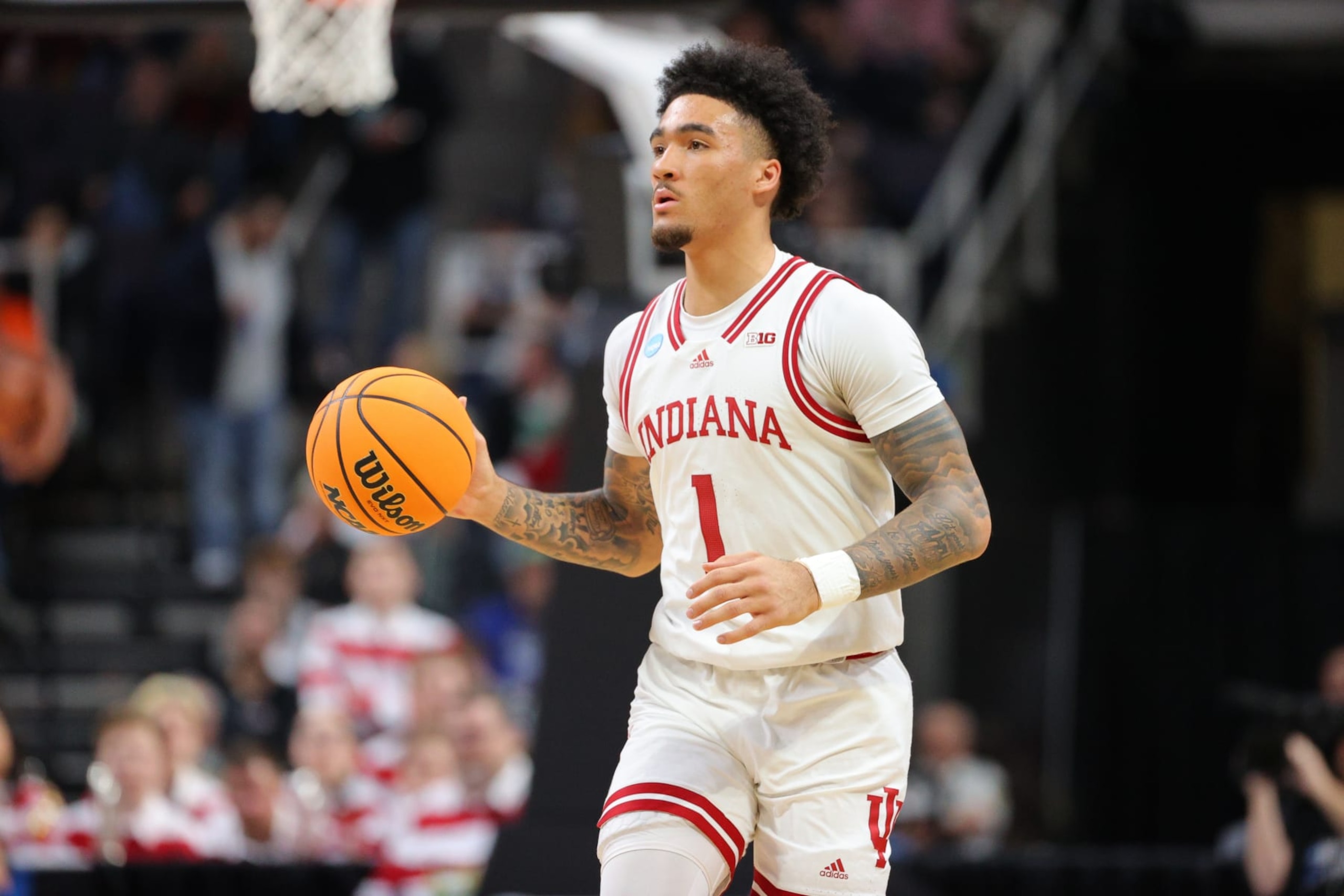 ALBANY, NY - MARCH 19: Jalen Hood-Schifino #1 of the Indiana Hoosiers dribbles against the Miami Hurricanes during the first half during the second round of the 2023 NCAA Men's Basketball Tournament held at MVP Arena on March 19, 2023 in Albany, New York. (Photo by C. Morgan Engel/NCAA Photos via Getty Images)