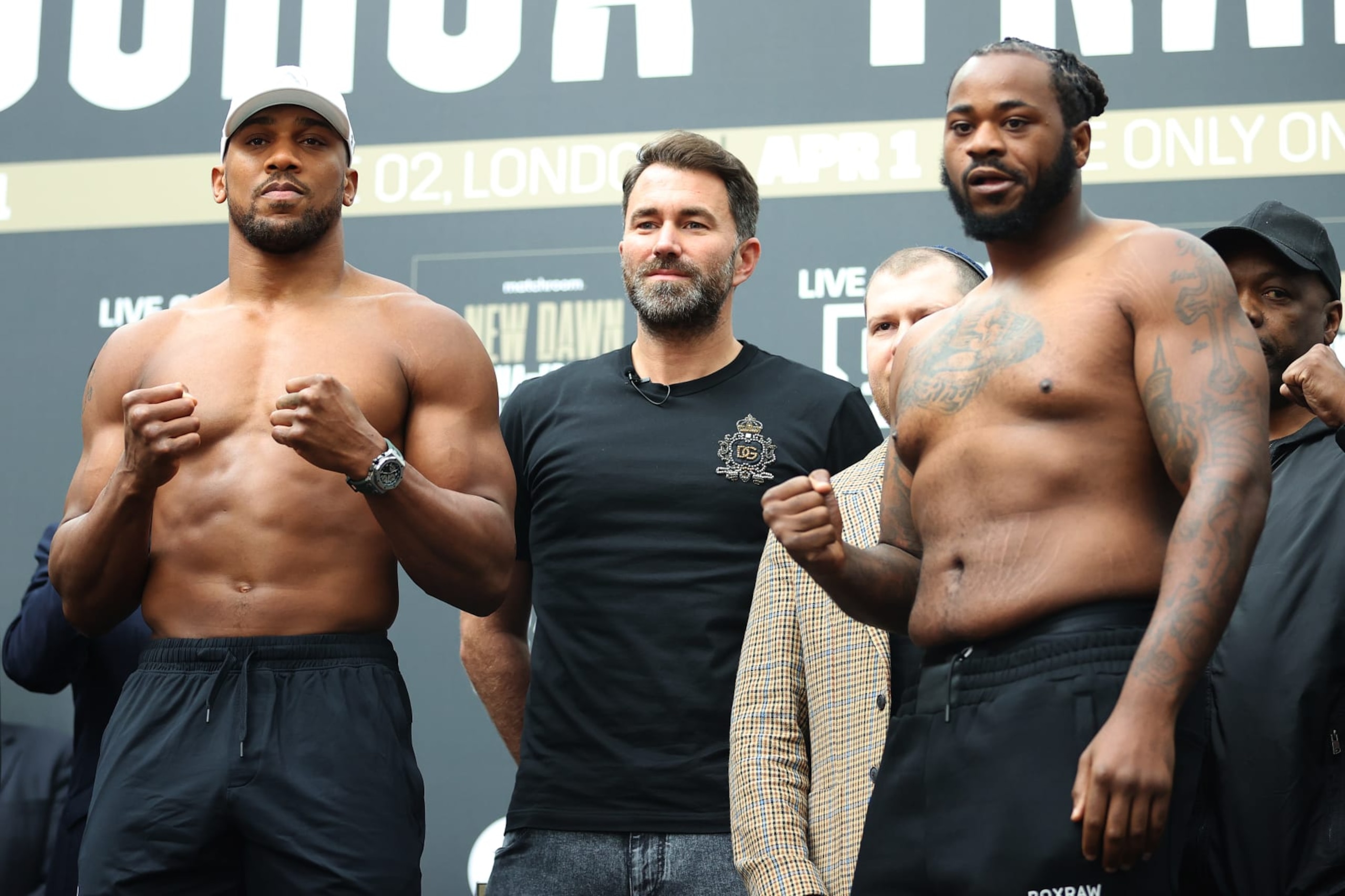 Anthony Joshua (left) and Jermaine Franklin (right) pose with promoter Eddie Hearn (middle).