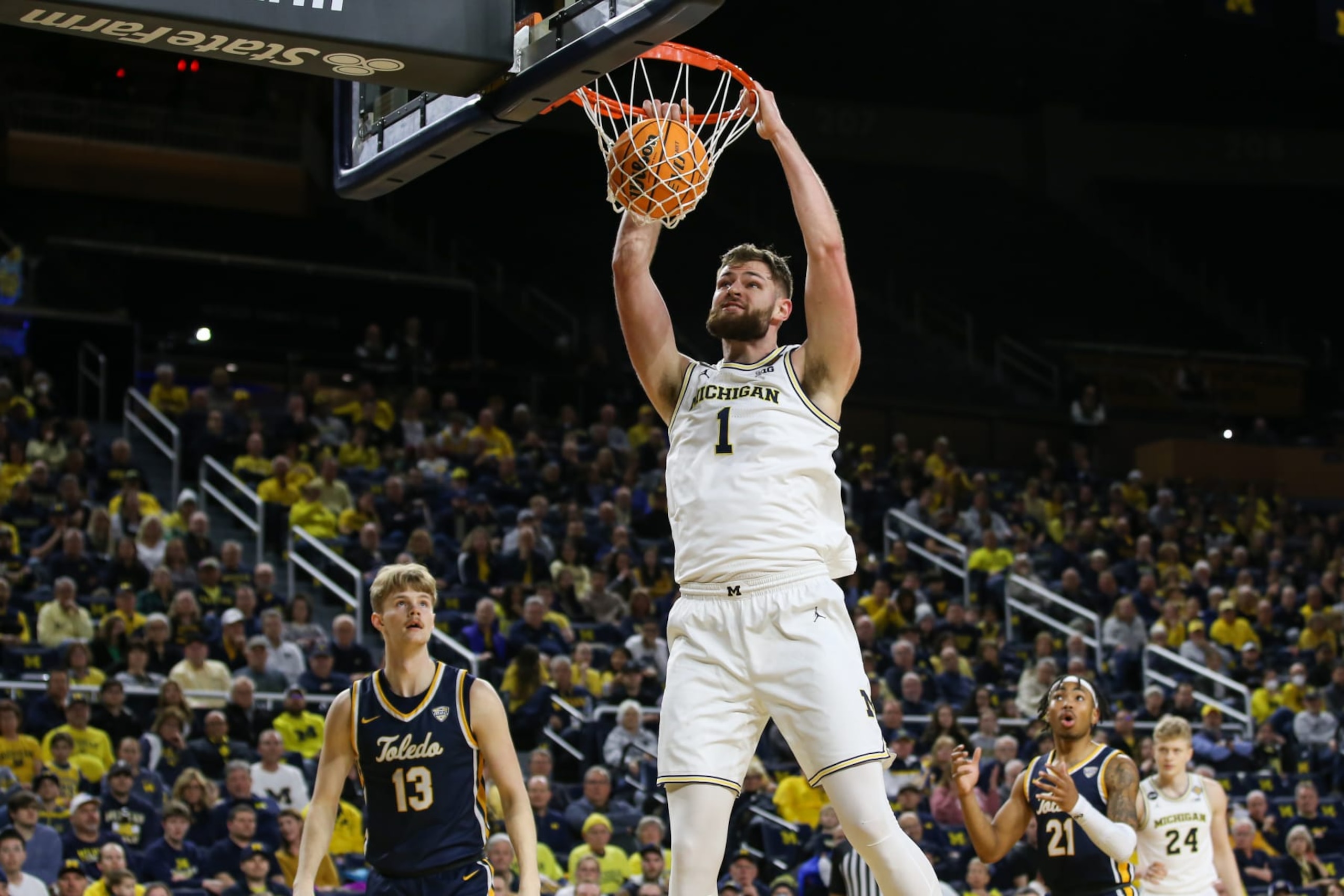 ANN ARBOR, MI - MARCH 14:  Michigan Wolverines center Hunter Dickinson (1) dunks the ball during the first half a first round college basketball game of the National Invitational Tournament between the Toledo Rockets and the Michigan Wolverines on March 14, 2023 at the Crisler Center in Ann Arbor, Michigan.  (Photo by Scott W. Grau/Icon Sportswire via Getty Images)