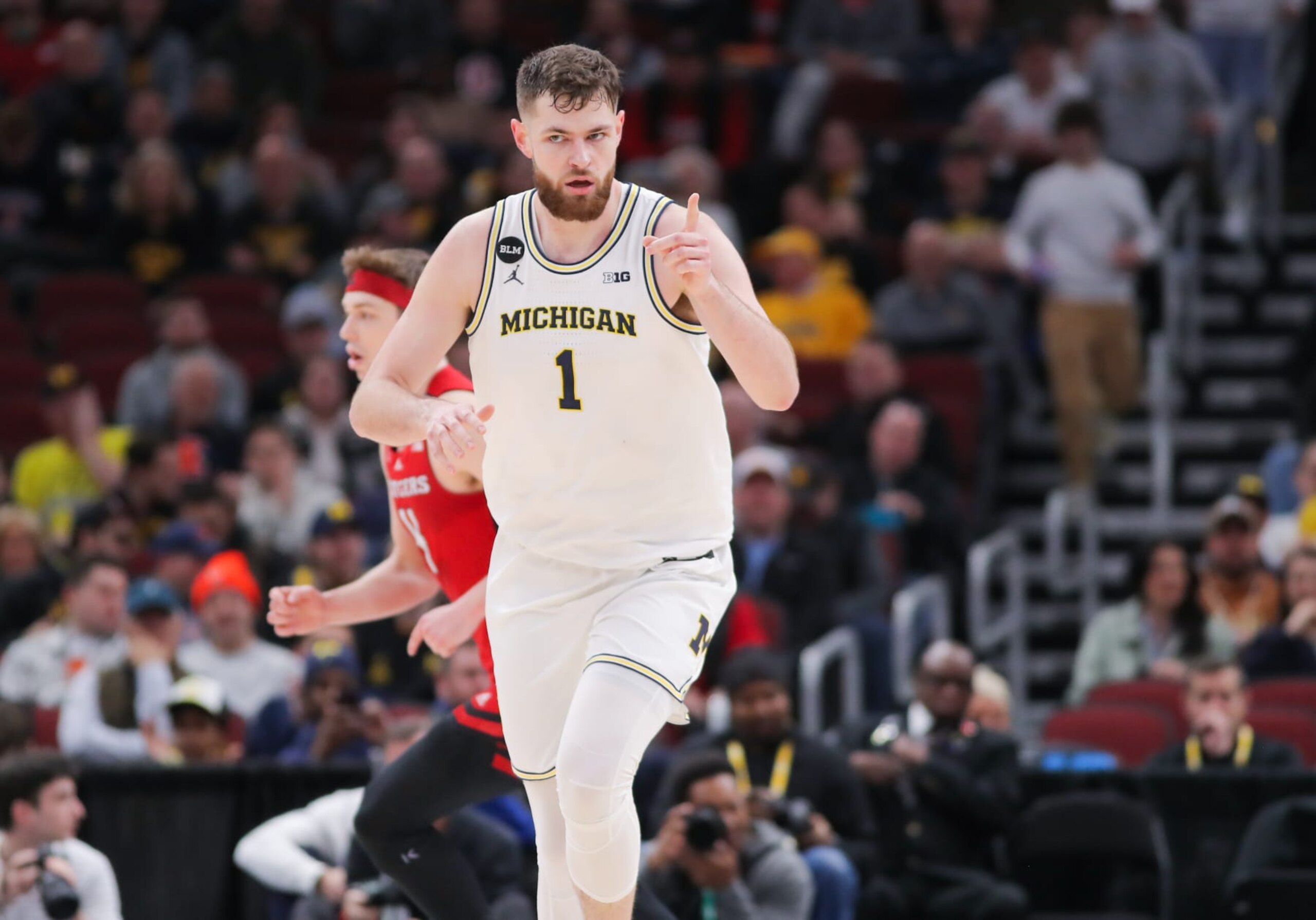 CHICAGO, IL - MARCH 09: Michigan Wolverines center Hunter Dickinson (1) reacts after a play during the first half of the second round of the Big Ten Conference Men's Basketball Tournament game between the Rutgers Scarlet Knights and the Michigan Wolverines on March 09, 2023, at the United Center in Chicago, IL. (Photo by Melissa Tamez/Icon Sportswire via Getty Images)
