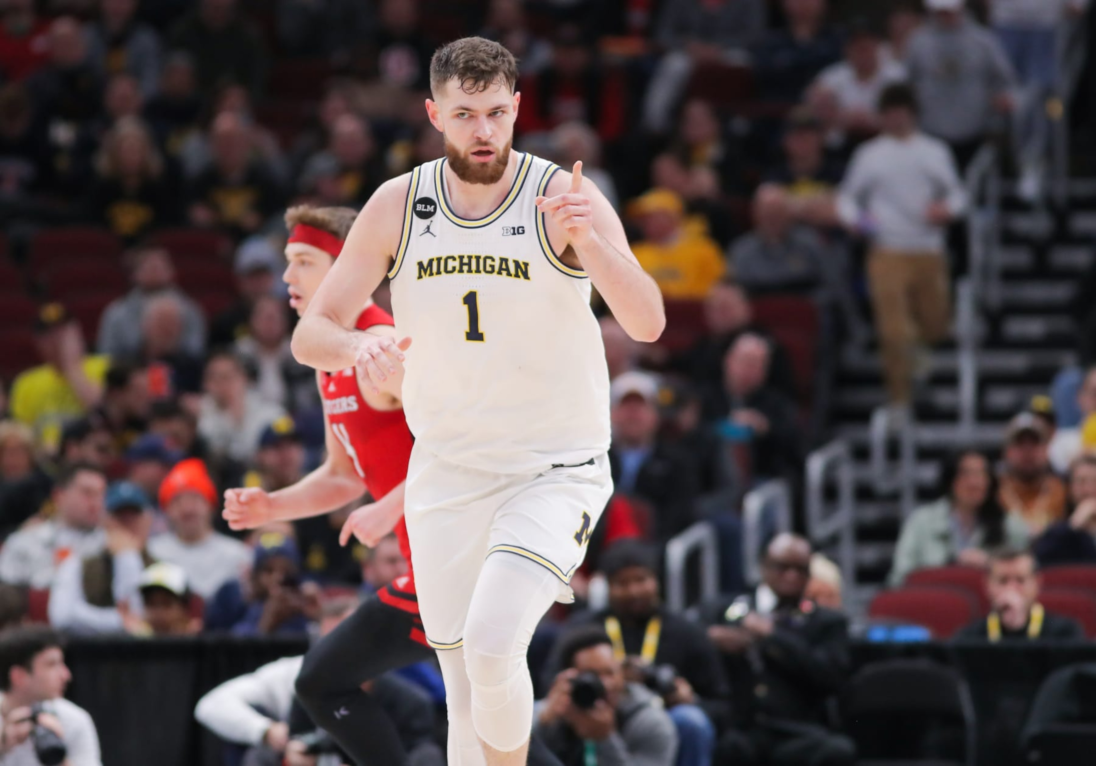 CHICAGO, IL - MARCH 09: Michigan Wolverines center Hunter Dickinson (1) reacts after a play during the first half of the second round of the Big Ten Conference Men's Basketball Tournament game between the Rutgers Scarlet Knights and the Michigan Wolverines on March 09, 2023, at the United Center in Chicago, IL. (Photo by Melissa Tamez/Icon Sportswire via Getty Images) CHICAGO, IL - MARCH 09: Michigan Wolverines center Hunter Dickinson (1) reacts after a play during the first half of the second round of the Big Ten Conference Men's Basketball Tournament game between the Rutgers Scarlet Knights and the Michigan Wolverines on March 09, 2023, at the United Center in Chicago, IL. (Photo by Melissa Tamez/Icon Sportswire via Getty Images)