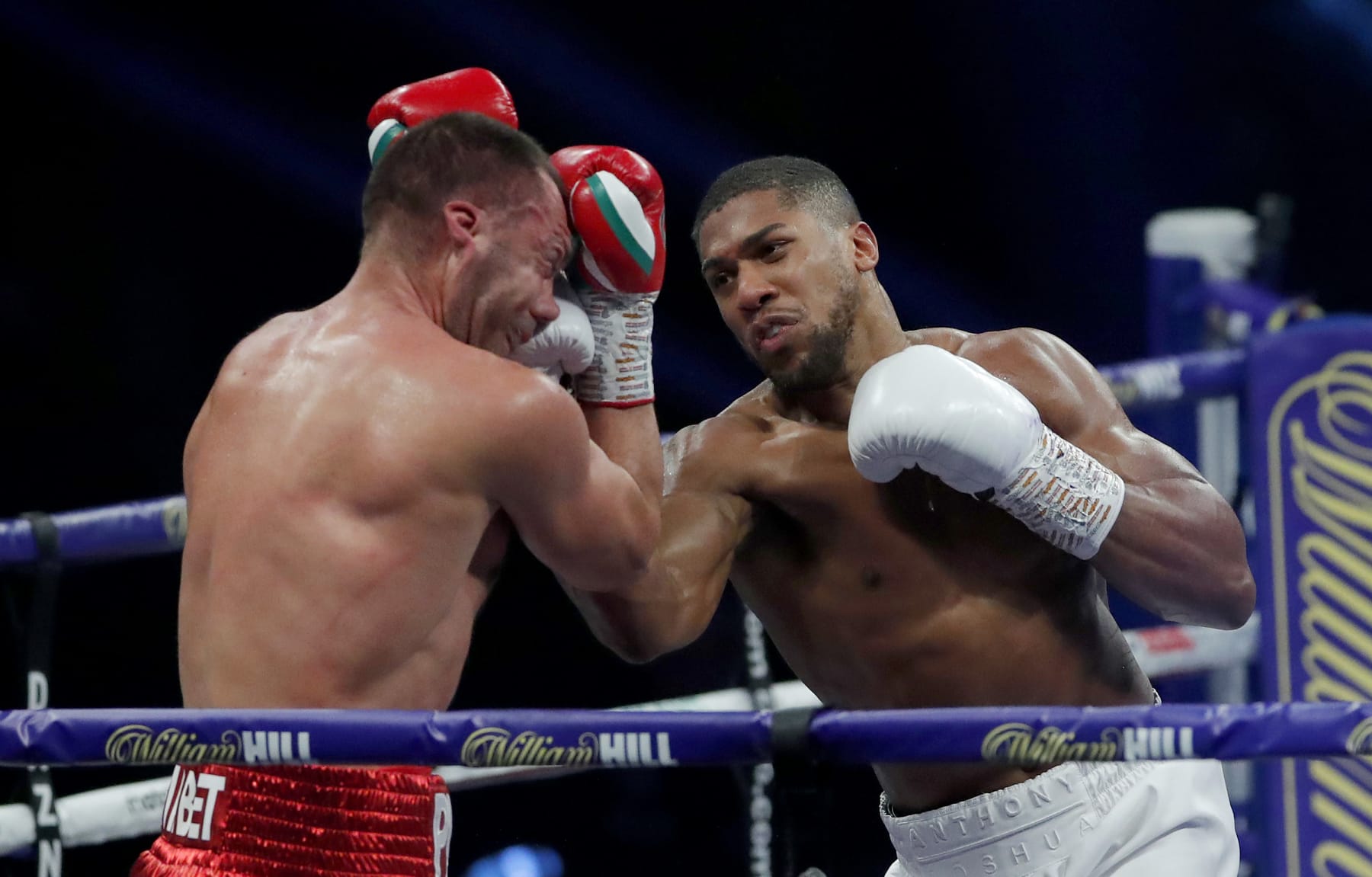 LONDON, ENGLAND - DECEMBER 12: Anthony Joshua punches Kubrat Pulev during the IBF, WBA, WBO and IBO World Heayweight Title fight between Anthony Joshua and Kubrat Pulev at The SSE Arena, Wembley on December 12, 2020 in London, England. A limited number of fans (1000) are welcomed back to sporting venues to watch elite sport across England. This was following easing of restrictions on spectators in tiers one and two areas only. (Photo by Andrew Couldridge - Pool/Getty Images)