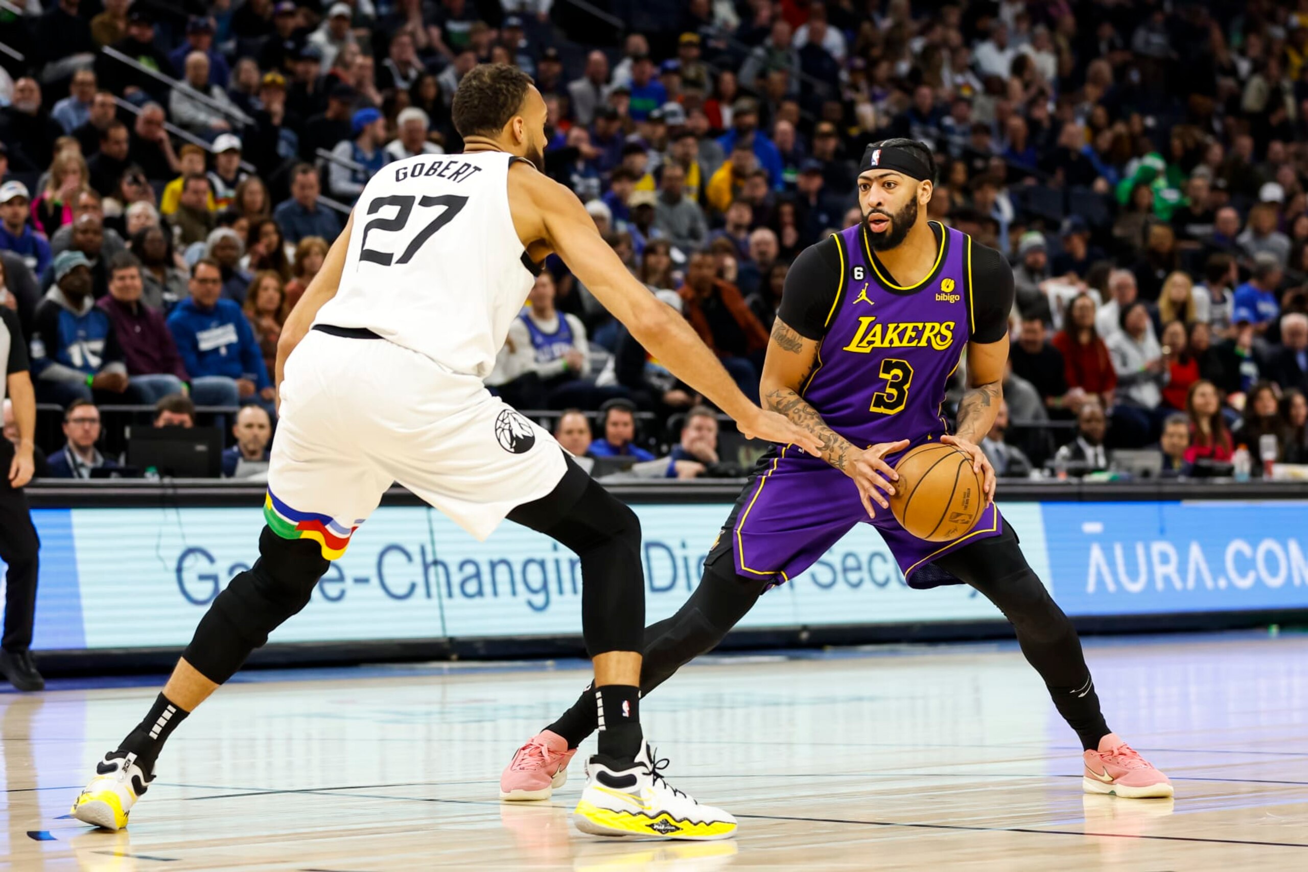 MINNEAPOLIS, MN - MARCH 31: Anthony Davis #3 of the Los Angeles Lakers dribbles the ball while Rudy Gobert #27 of the Minnesota Timberwolves defends in the first quarter of the game at Target Center on March 31, 2023 in Minneapolis, Minnesota. NOTE TO USER: User expressly acknowledges and agrees that, by downloading and or using this Photograph, user is consenting to the terms and conditions of the Getty Images License Agreement. (Photo by David Berding/Getty Images)