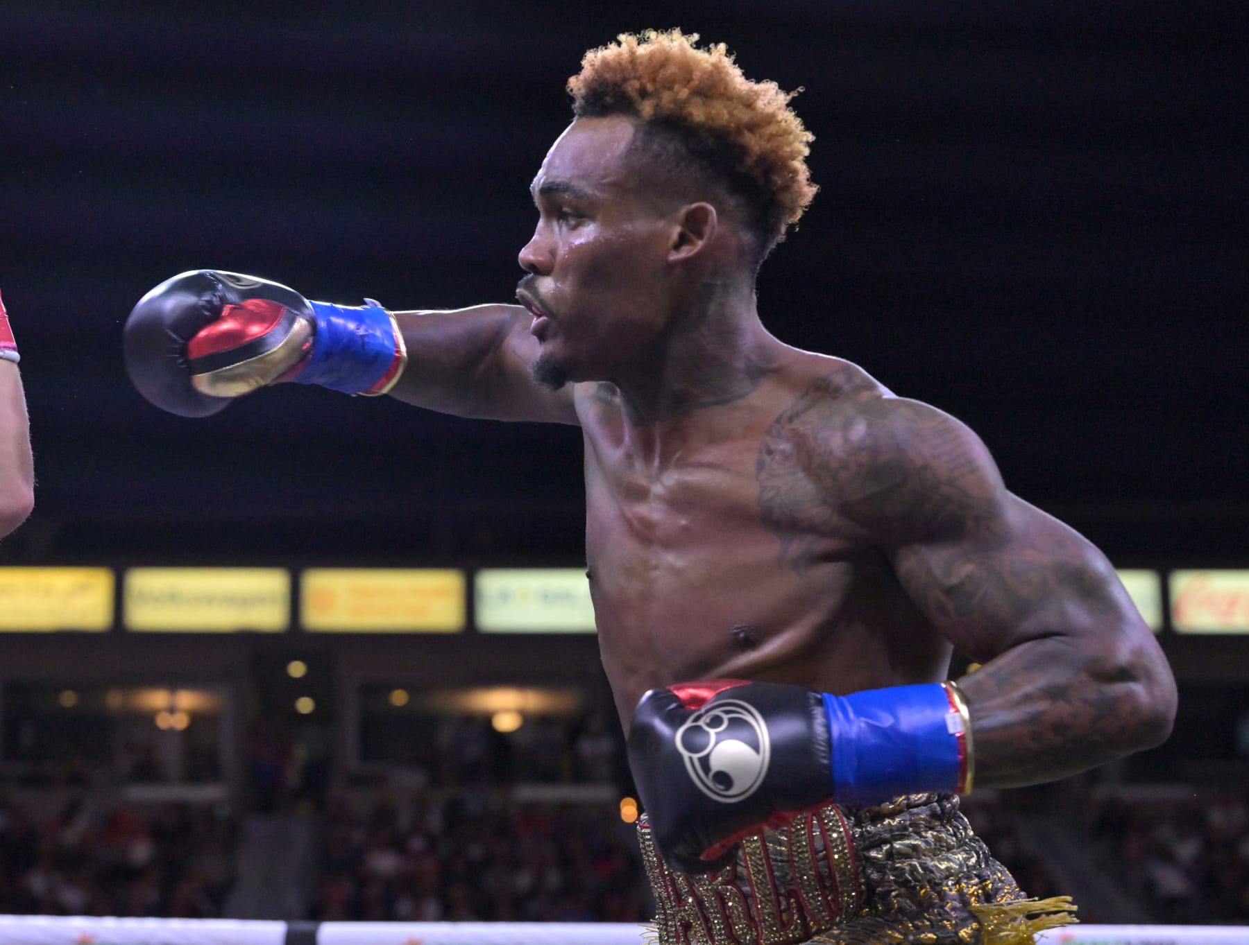 CARSON, CA - MAY 14: Jermell Charlo (gold/red shorts) exchanges punches in the ring with Brian Castano during their super middleweight title fight at Dignity Health Sports Park on May 14, 2022 in Carson, California. Charlo won by knockout in the 10th round. (Photo by Jayne Kamin-Oncea/Getty Images)