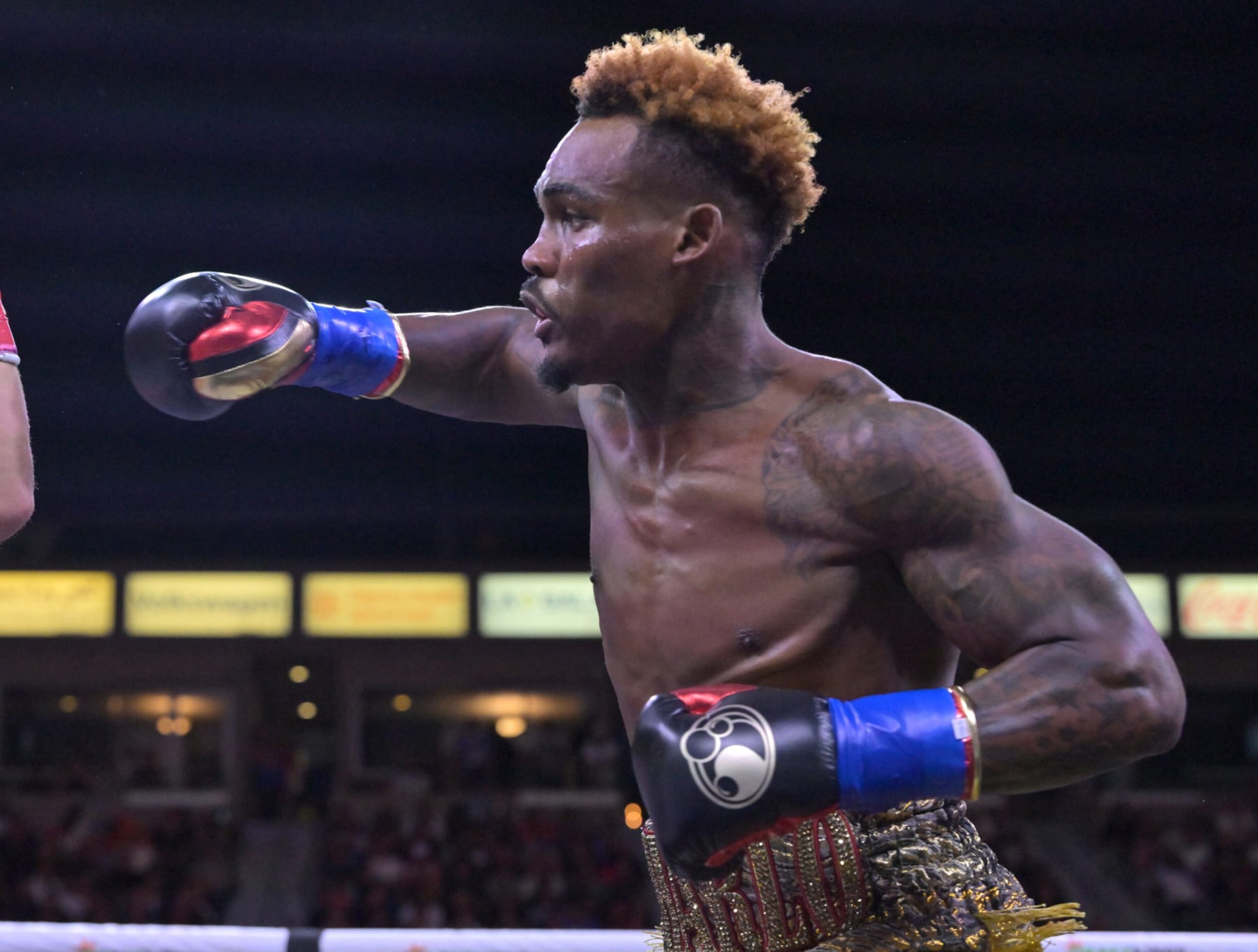 CARSON, CA - MAY 14: Jermell Charlo (gold/red shorts) exchanges punches in the ring with Brian Castano during their super middleweight title fight at Dignity Health Sports Park on May 14, 2022 in Carson, California. Charlo won by knockout in the 10th round. (Photo by Jayne Kamin-Oncea/Getty Images)