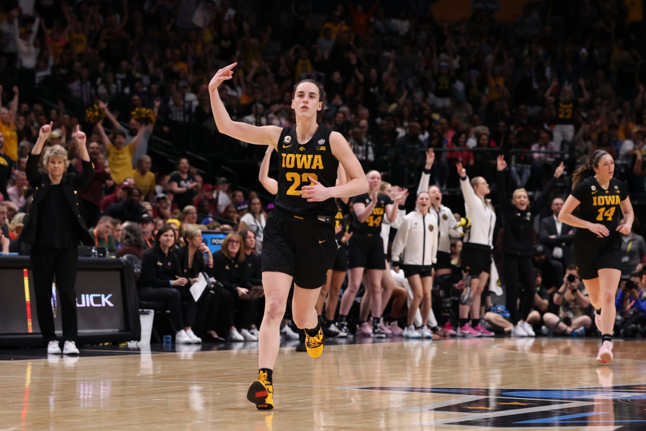 DALLAS, TEXAS - MARCH 31: Caitlin Clark #22 of the Iowa Hawkeyes reacts after a three point basket during the fourth quarter against the South Carolina Gamecocks during the 2023 NCAA Women's Basketball Tournament Final Four semifinal game at American Airlines Center on March 31, 2023 in Dallas, Texas. (Photo by Tom Pennington/Getty Images)