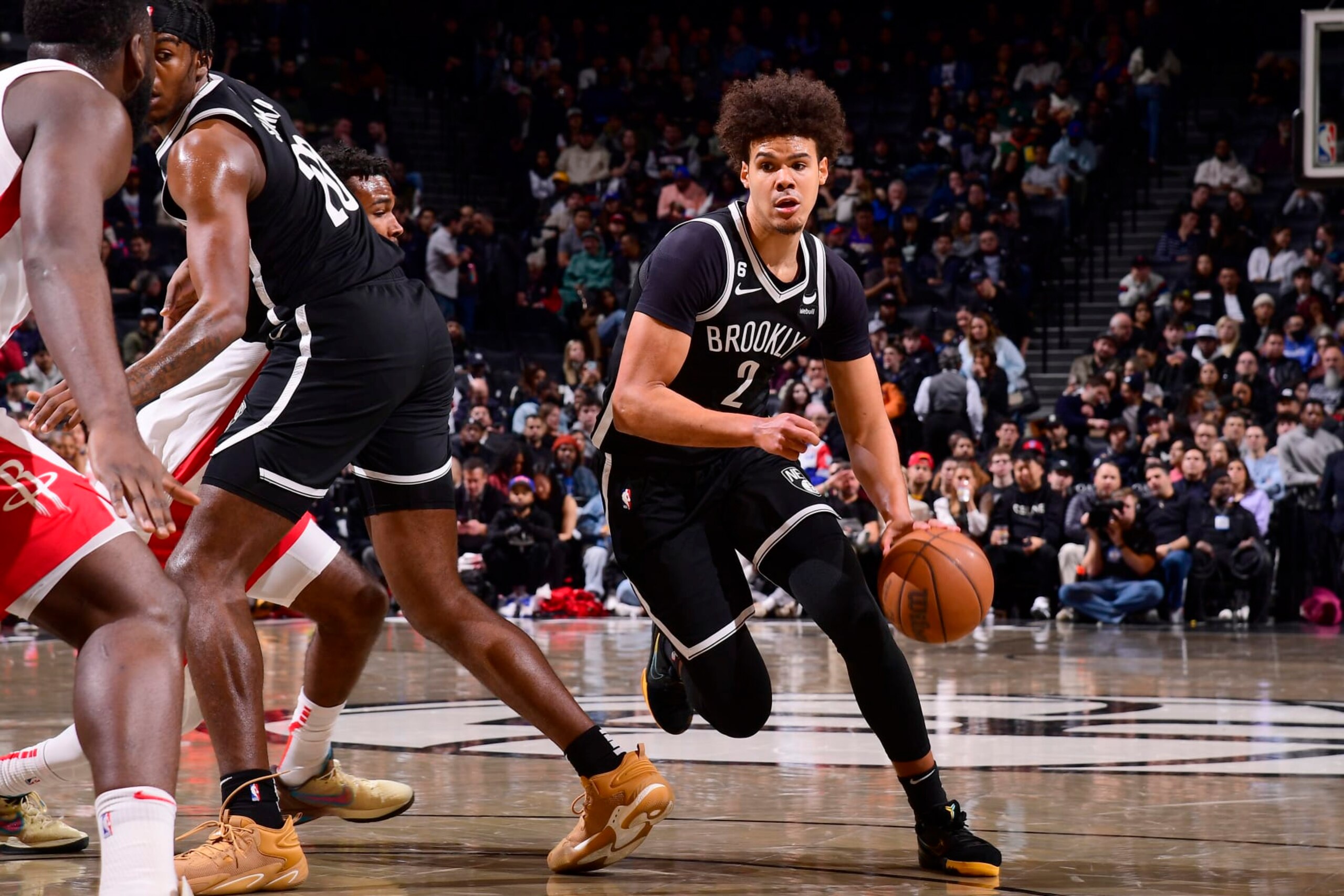 BROOKLYN, NY - MARCH 29: Cameron Johnson #2 of the Brooklyn Nets moves the ball during the game against the Houston Rockets on March 29, 2023 at Barclays Center in Brooklyn, New York. NOTE TO USER: User expressly acknowledges and agrees that, by downloading and or using this Photograph, user is consenting to the terms and conditions of the Getty Images License Agreement. Mandatory Copyright Notice: Copyright 2023 NBAE (Photo by Brian Babineau/NBAE via Getty Images)