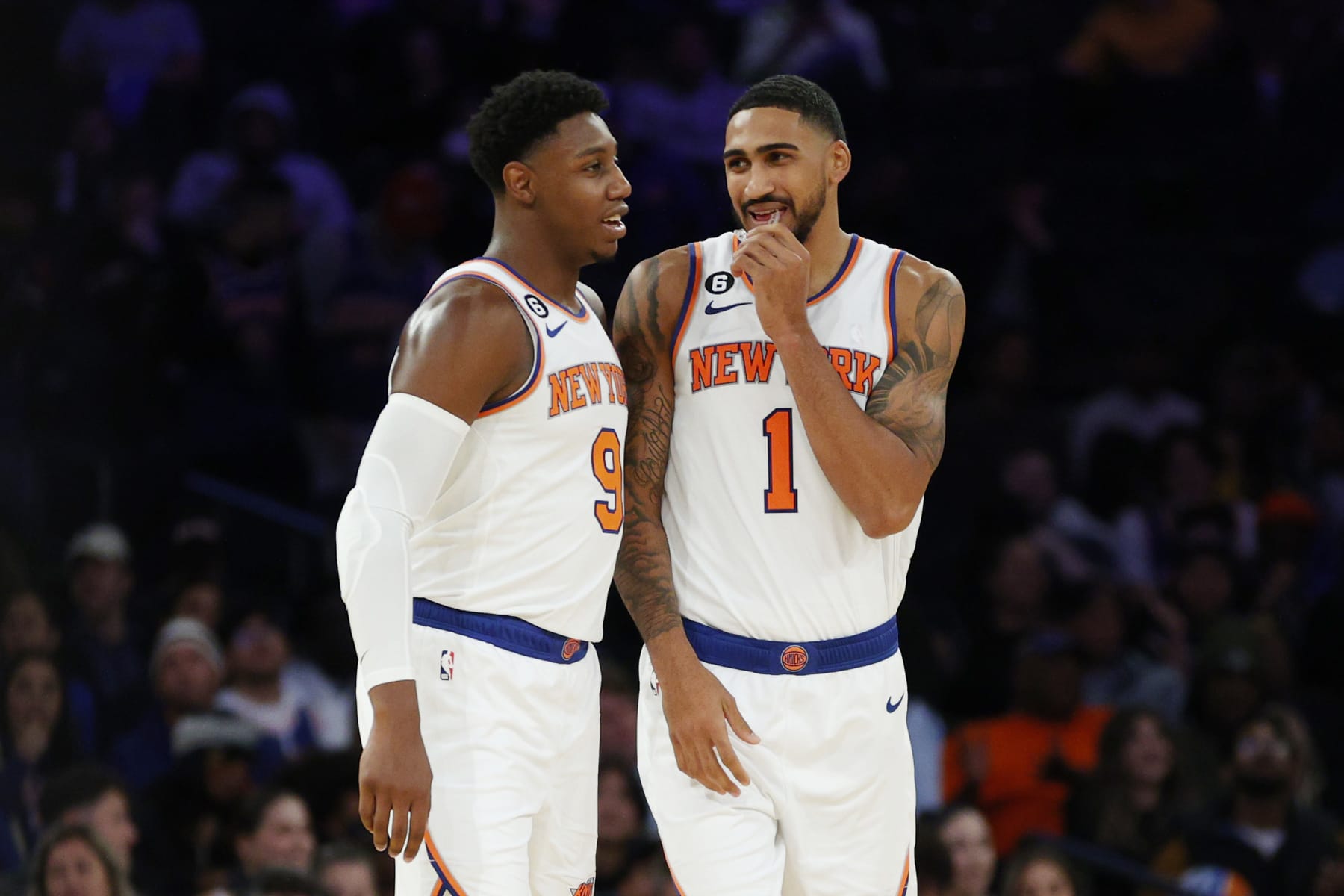 NEW YORK, NEW YORK - OCTOBER 04: RJ Barrett #9 talks with Obi Toppin #1 of the New York Knicks during the second half against the Detroit Pistons at Madison Square Garden on October 04, 2022 in New York City. NOTE TO USER: User expressly acknowledges and agrees that, by downloading and or using this photograph, User is consenting to the terms and conditions of the Getty Images License Agreement. (Photo by Sarah Stier/Getty Images)
