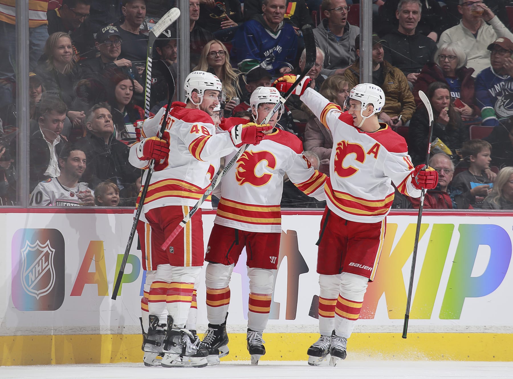 VANCOUVER, CANADA - MARCH 31: Blake Coleman #20 of the Calgary Flames celebrates his goal with teammates during the second period of their NHL game against the Vancouver Canucks at Rogers Arena March 31, 2023 in Vancouver, British Columbia, Canada.  (Photo by Jeff Vinnick/NHLI via Getty Images)