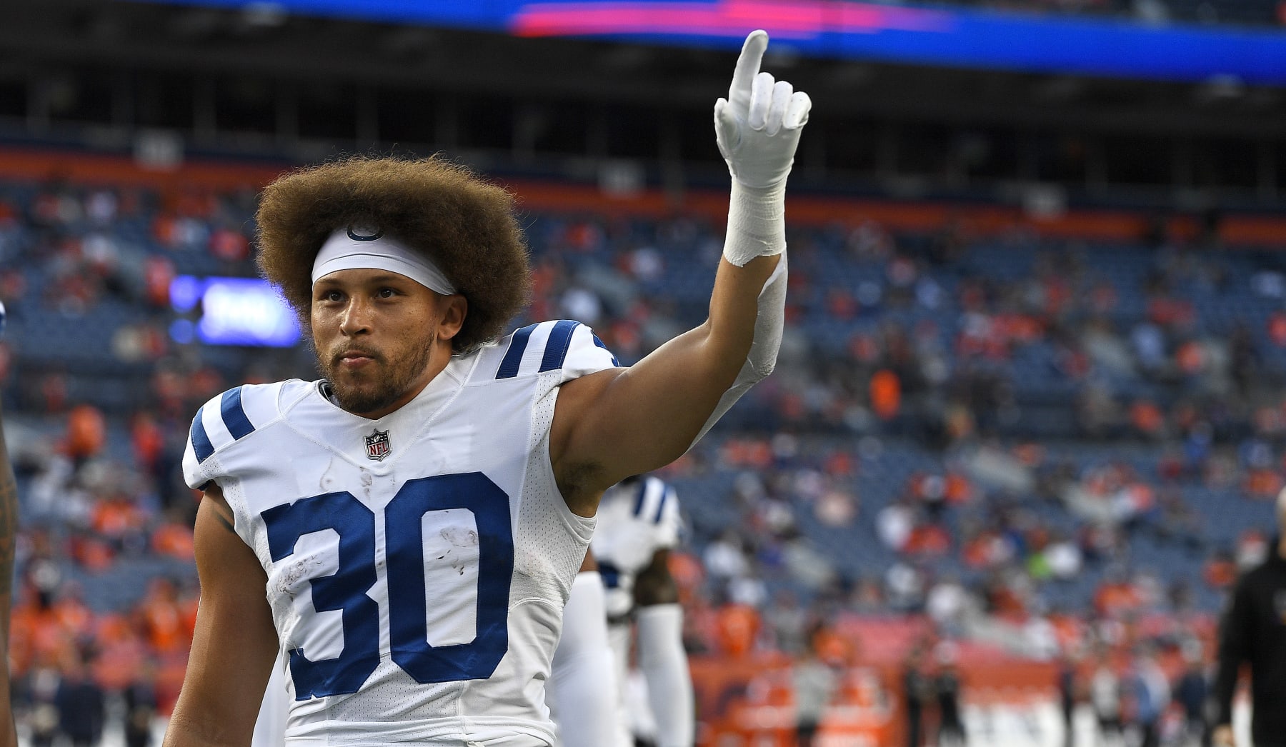 DENVER, COLORADO - OCTOBER 06: Phillip Lindsay #30 of the Indianapolis Colts looks on during a game against the Denver Broncos at Empower Field At Mile High on October 06, 2022 in Denver, Colorado. (Photo by Dustin Bradford/Getty Images)