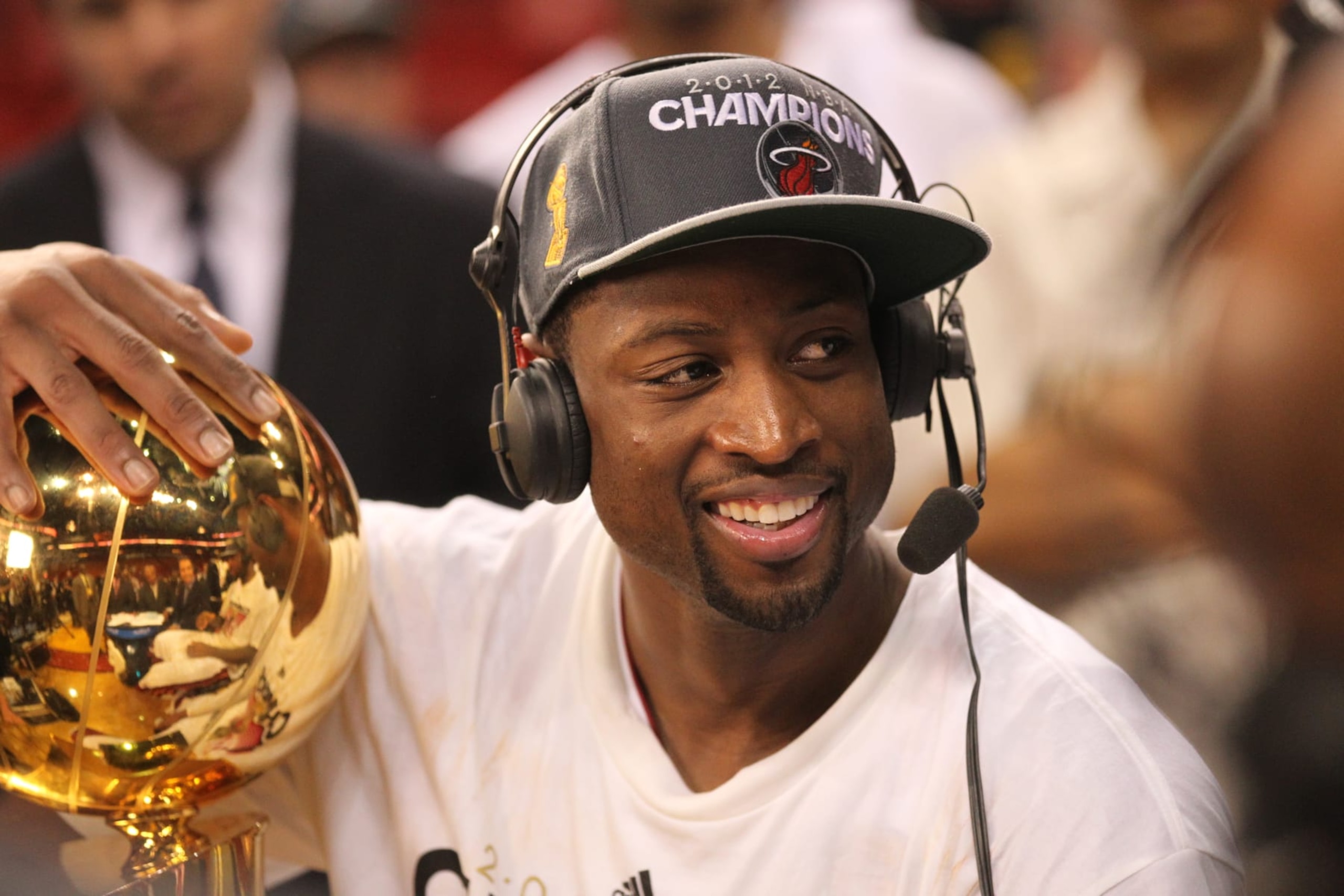 MIAMI, FL - JUNE 21:  Dwyane Wade #3 of the Miami Heat talks to the media while holding the Larry O'Brien NBA Championship Trophy after his team wins the NBA Championship by defeating the Oklahoma City Thunder in Game Five of the 2012 NBA Finals at American Airlines Arena on June 21, 2012 in Miami, Florida.  NOTE TO USER: User expressly acknowledges and agrees that, by downloading and or using this Photograph, user is consenting to the terms and conditions of the Getty Images License Agreement. Mandatory Copyright Notice: Copyright 2012 NBAE (Photo by Layne Murdoch/NBAE via Getty Images)