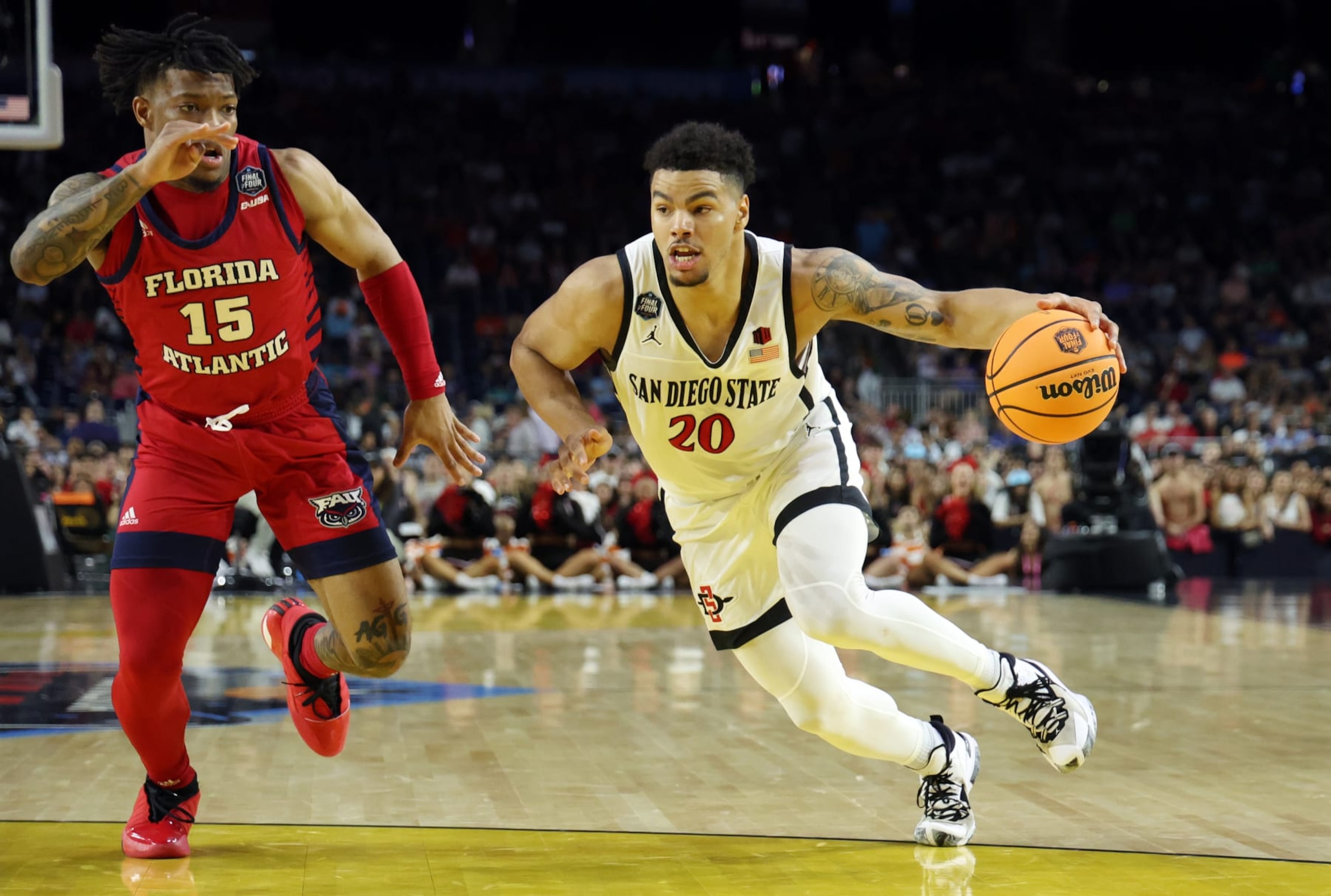 HOUSTON, TEXAS - APRIL 01: Matt Bradley #20 of the San Diego State Aztecs drives the ball against Alijah Martin #15 of the Florida Atlantic Owls during the first half during the NCAA Men's Basketball Tournament Final Four semifinal game at NRG Stadium on April 01, 2023 in Houston, Texas. (Photo by Gregory Shamus/Getty Images) HOUSTON, TEXAS - APRIL 01: Matt Bradley #20 of the San Diego State Aztecs drives the ball against Alijah Martin #15 of the Florida Atlantic Owls during the first half during the NCAA Men's Basketball Tournament Final Four semifinal game at NRG Stadium on April 01, 2023 in Houston, Texas. (Photo by Gregory Shamus/Getty Images)