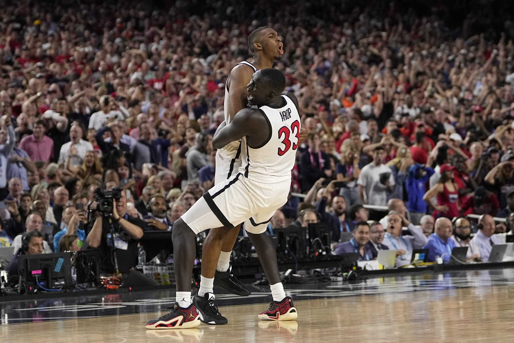 San Diego State guard Lamont Butler, left, celebrates after scoring the game winning basket with forward Aguek Arop during the second half of a Final Four college basketball game against Florida Atlantic in the NCAA Tournament on Saturday, April 1, 2023, in Houston. (AP Photo/David J. Phillip)