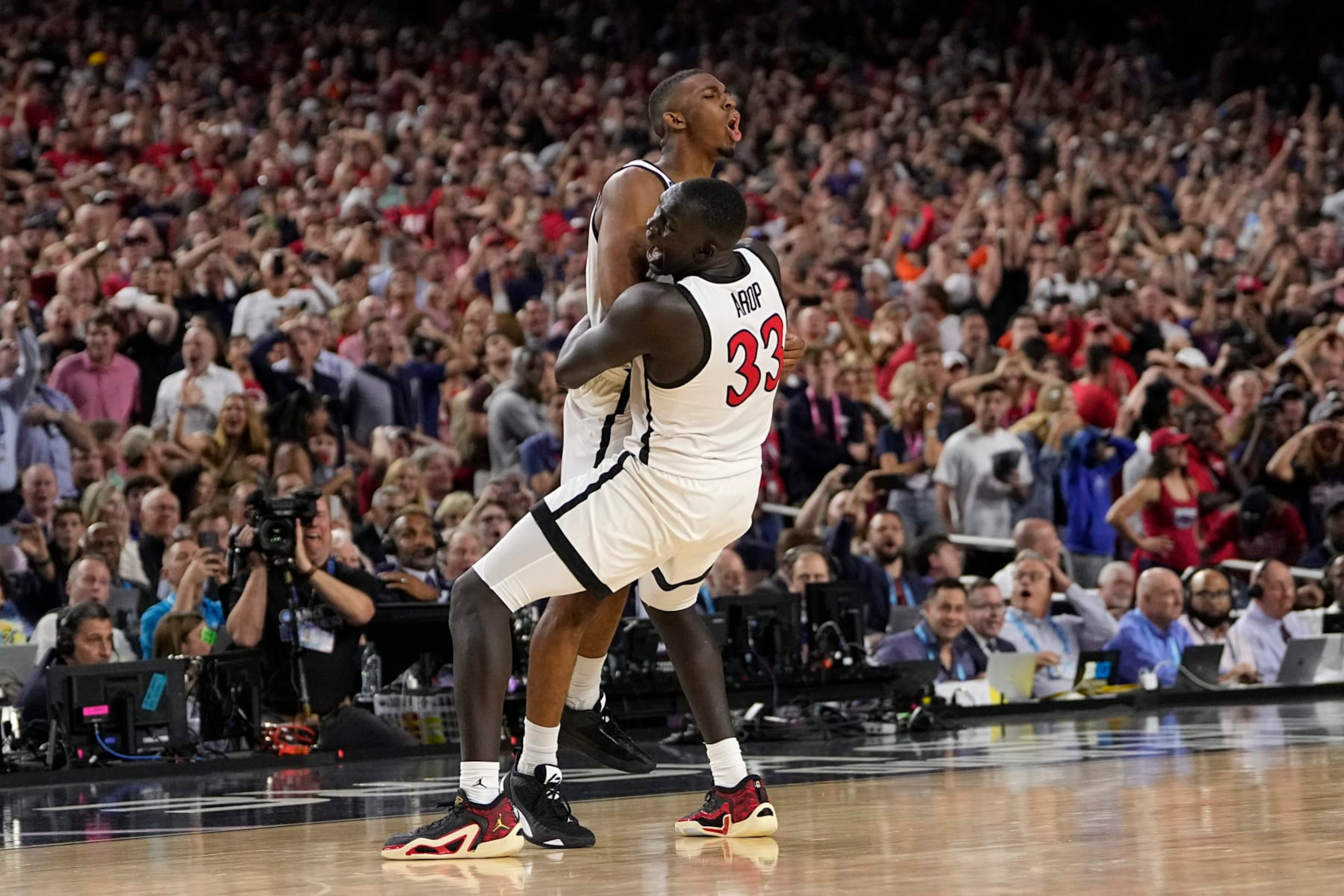 San Diego State guard Lamont Butler, left, celebrates after scoring the game winning basket with forward Aguek Arop during the second half of a Final Four college basketball game against Florida Atlantic in the NCAA Tournament on Saturday, April 1, 2023, in Houston. (AP Photo/David J. Phillip) San Diego State guard Lamont Butler, left, celebrates after scoring the game winning basket with forward Aguek Arop during the second half of a Final Four college basketball game against Florida Atlantic in the NCAA Tournament on Saturday, April 1, 2023, in Houston. (AP Photo/David J. Phillip)
