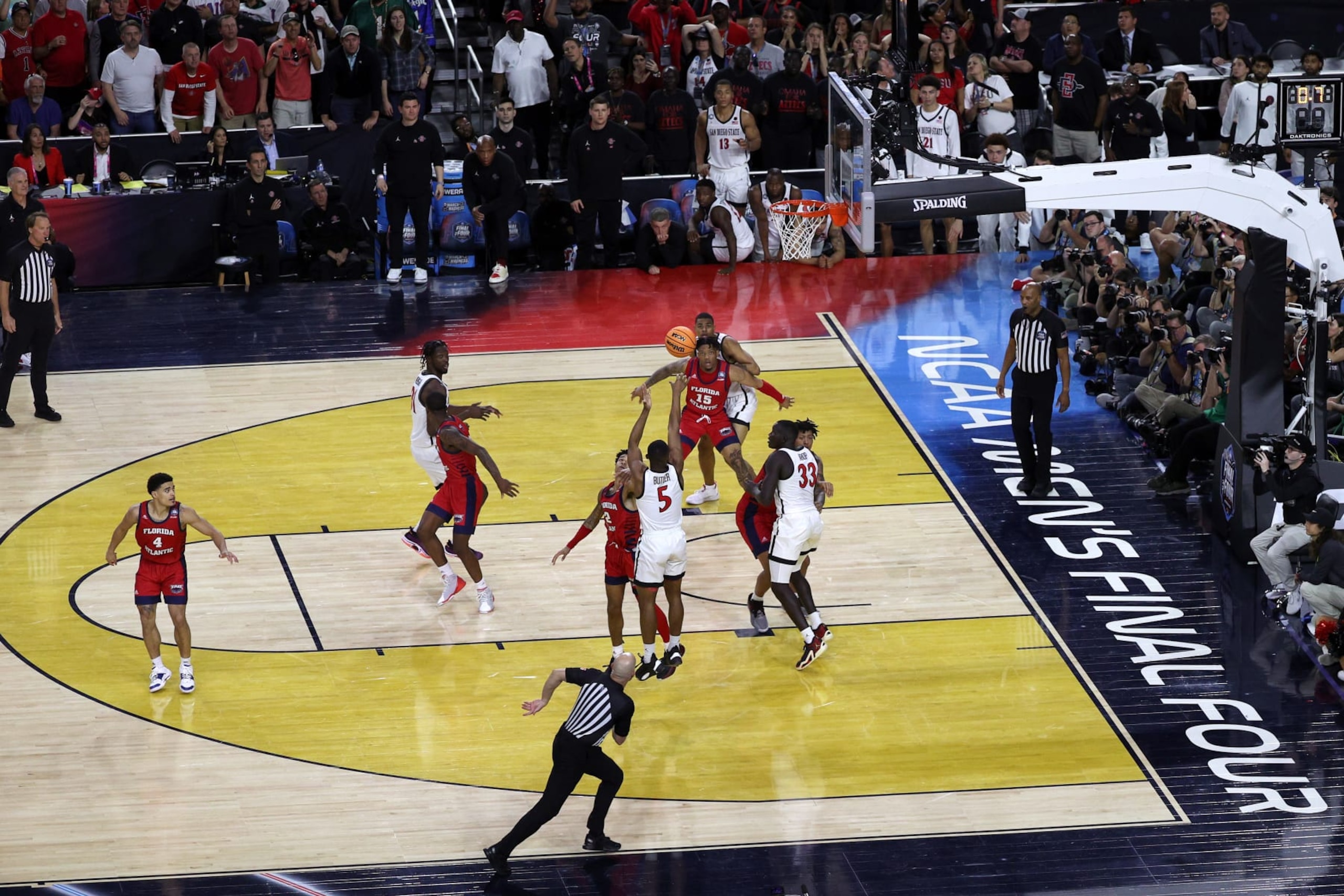 HOUSTON, TEXAS - APRIL 01: Lamont Butler #5 of the San Diego State Aztecs makes a basket as the clock expires to defeat the Florida Atlantic Owls 72-71 during the NCAA Men's Basketball Tournament Final Four semifinal game at NRG Stadium on April 01, 2023 in Houston, Texas. (Photo by Mike Lawrie/Getty Images)