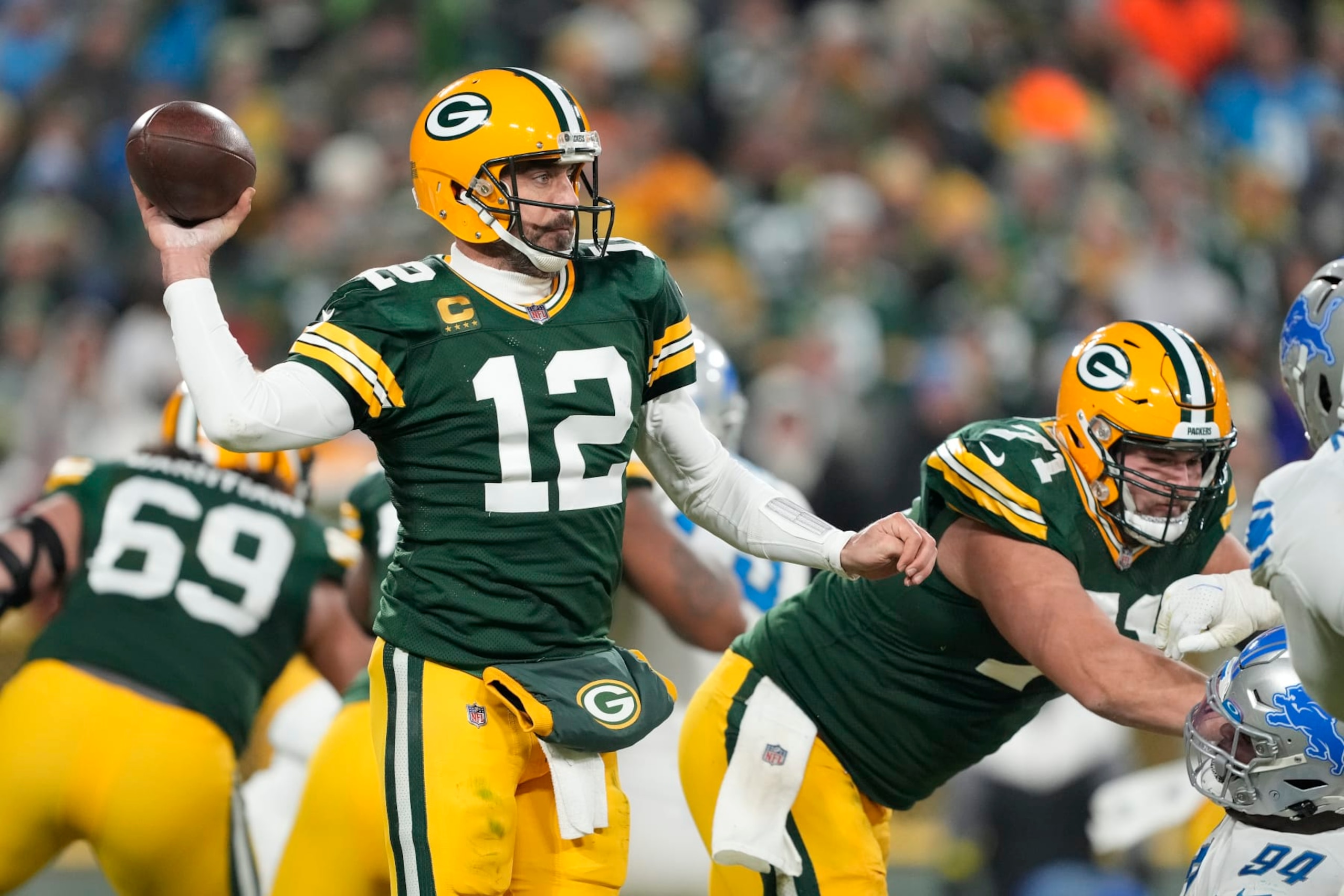 GREEN BAY, WISCONSIN - JANUARY 08: Aaron Rodgers #12 of the Green Bay Packers throws a pass against the Detroit Lions in the second half at Lambeau Field on January 08, 2023 in Green Bay, Wisconsin. (Photo by Patrick McDermott/Getty Images) GREEN BAY, WISCONSIN - JANUARY 08: Aaron Rodgers #12 of the Green Bay Packers throws a pass against the Detroit Lions in the second half at Lambeau Field on January 08, 2023 in Green Bay, Wisconsin. (Photo by Patrick McDermott/Getty Images)