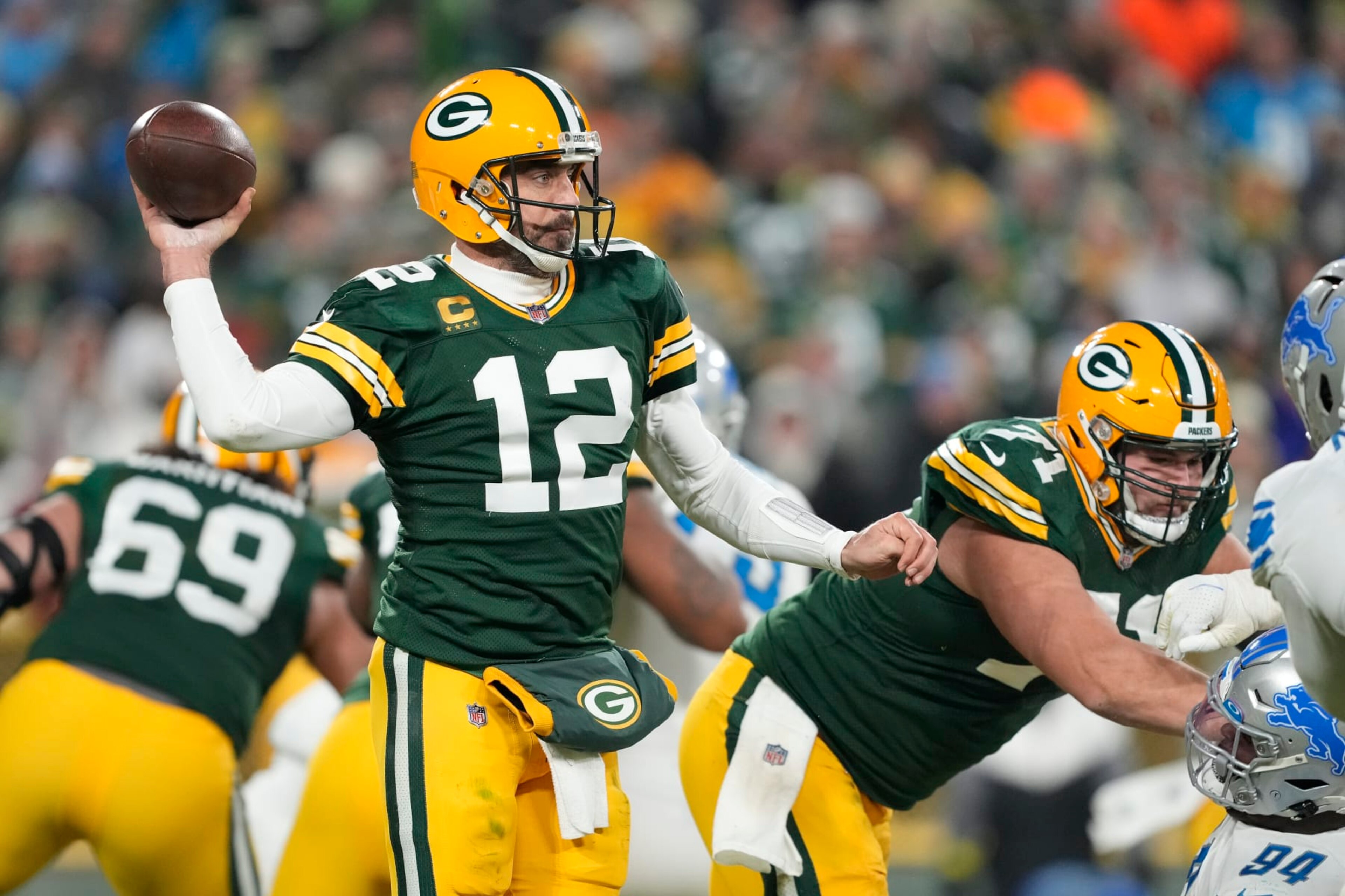 GREEN BAY, WISCONSIN - JANUARY 08: Aaron Rodgers #12 of the Green Bay Packers throws a pass against the Detroit Lions in the second half at Lambeau Field on January 08, 2023 in Green Bay, Wisconsin. (Photo by Patrick McDermott/Getty Images)
