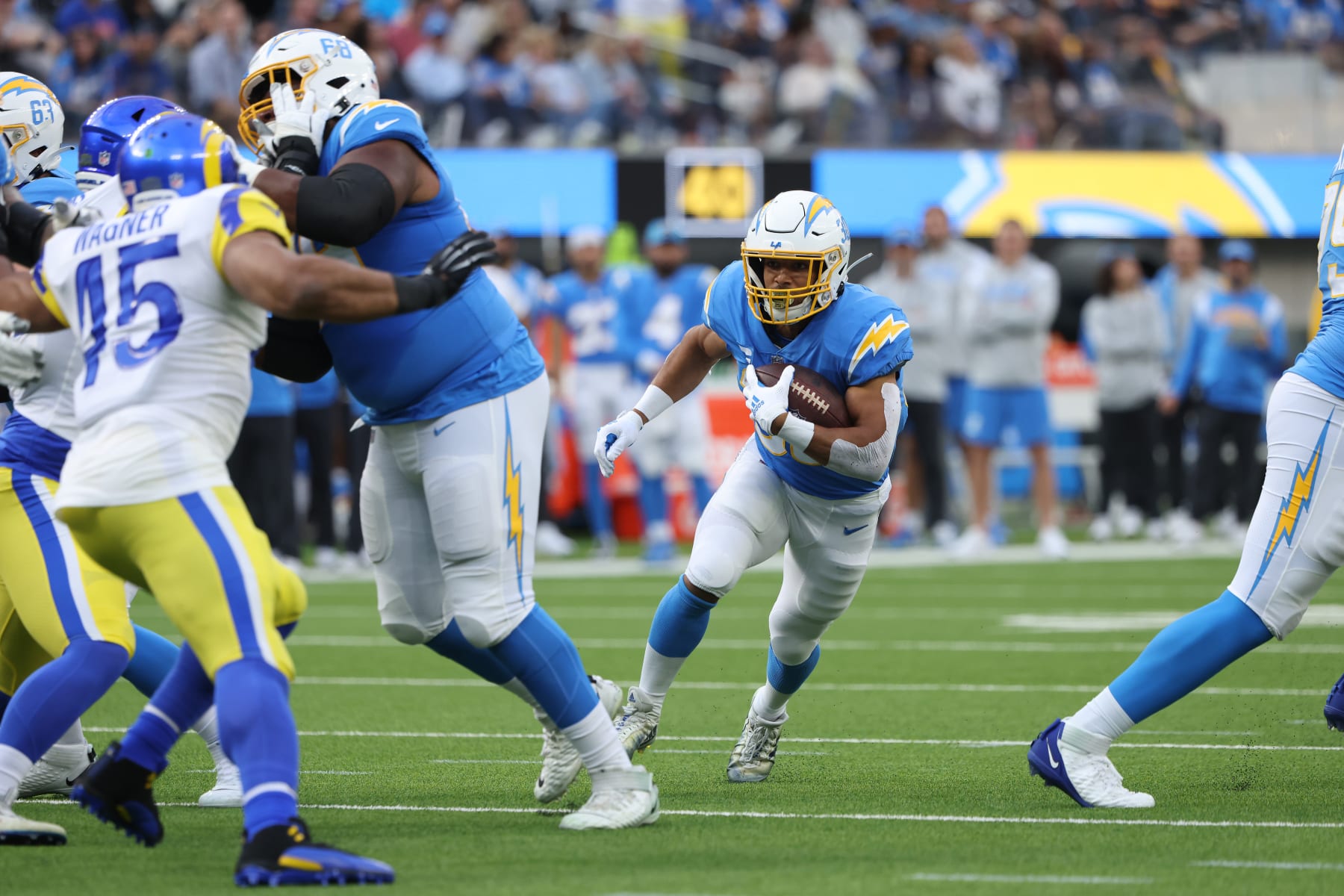 INGLEWOOD, CALIFORNIA - JANUARY 01: Austin Ekeler #30 of the Los Angeles Chargers runs the ball during the second quarter in the game against the Los Angeles Rams at SoFi Stadium on January 01, 2023 in Inglewood, California. (Photo by Katelyn Mulcahy/Getty Images)
