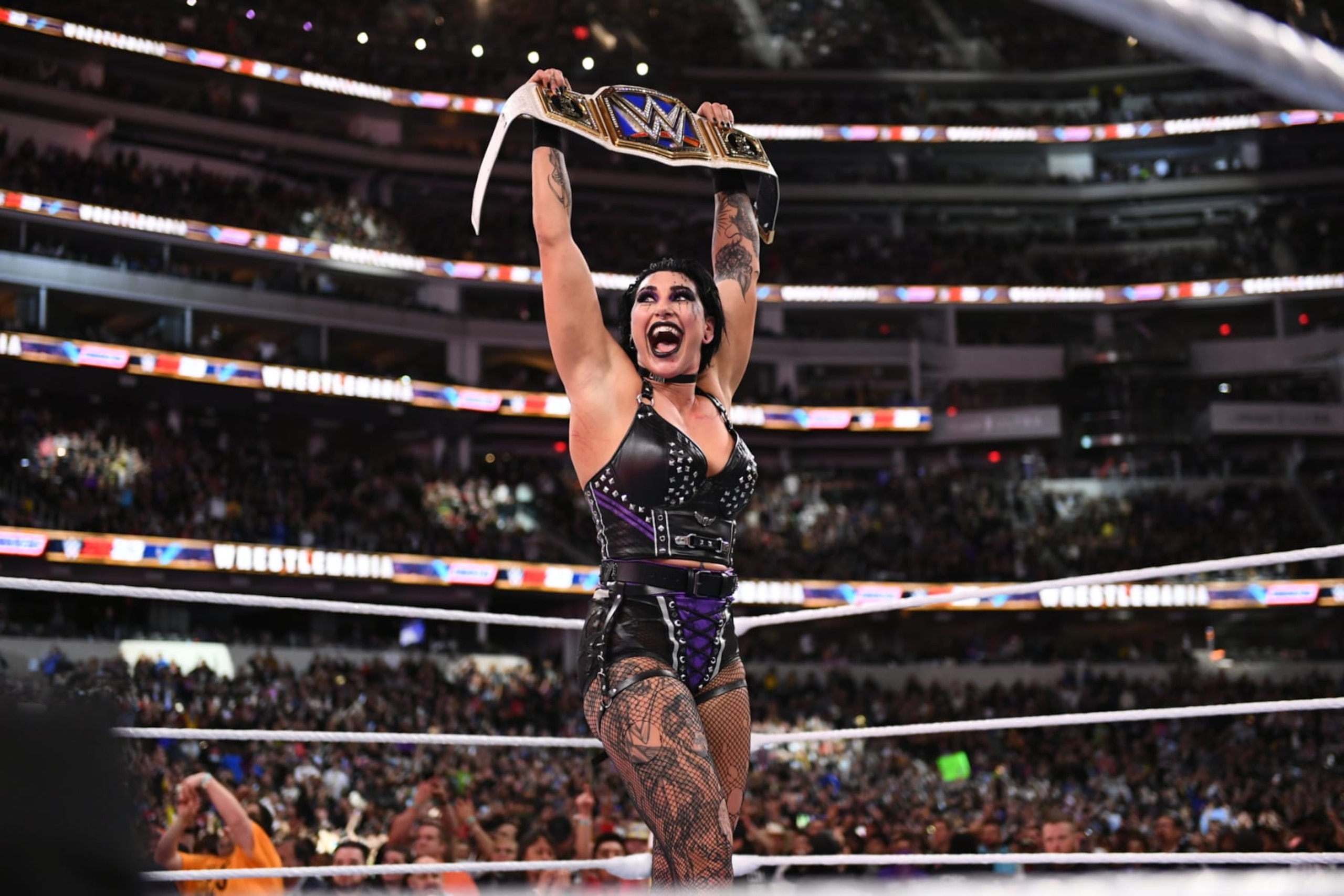 Rhea Ripley captured gold in a near-classic encounter with Charlotte Flair Saturday night. Rhea Ripley captured gold in a near-classic encounter with Charlotte Flair Saturday night.