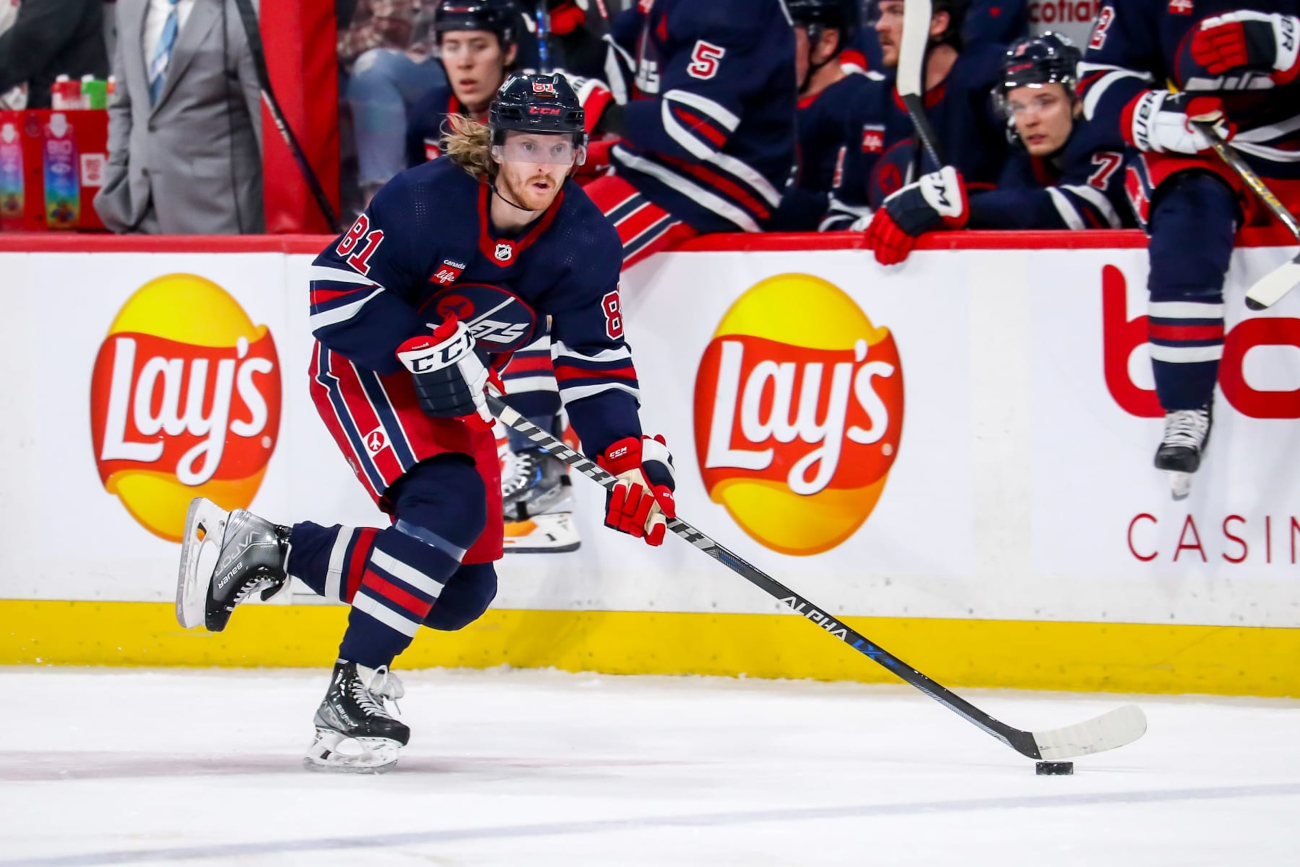 WINNIPEG, CANADA - MARCH 31: Kyle Connor #81 of the Winnipeg Jets carries the puck down the ice during second period action against the Detroit Red Wings at the Canada Life Centre on March 31, 2023 in Winnipeg, Manitoba, Canada. (Photo by Darcy Finley/NHLI via Getty Images)